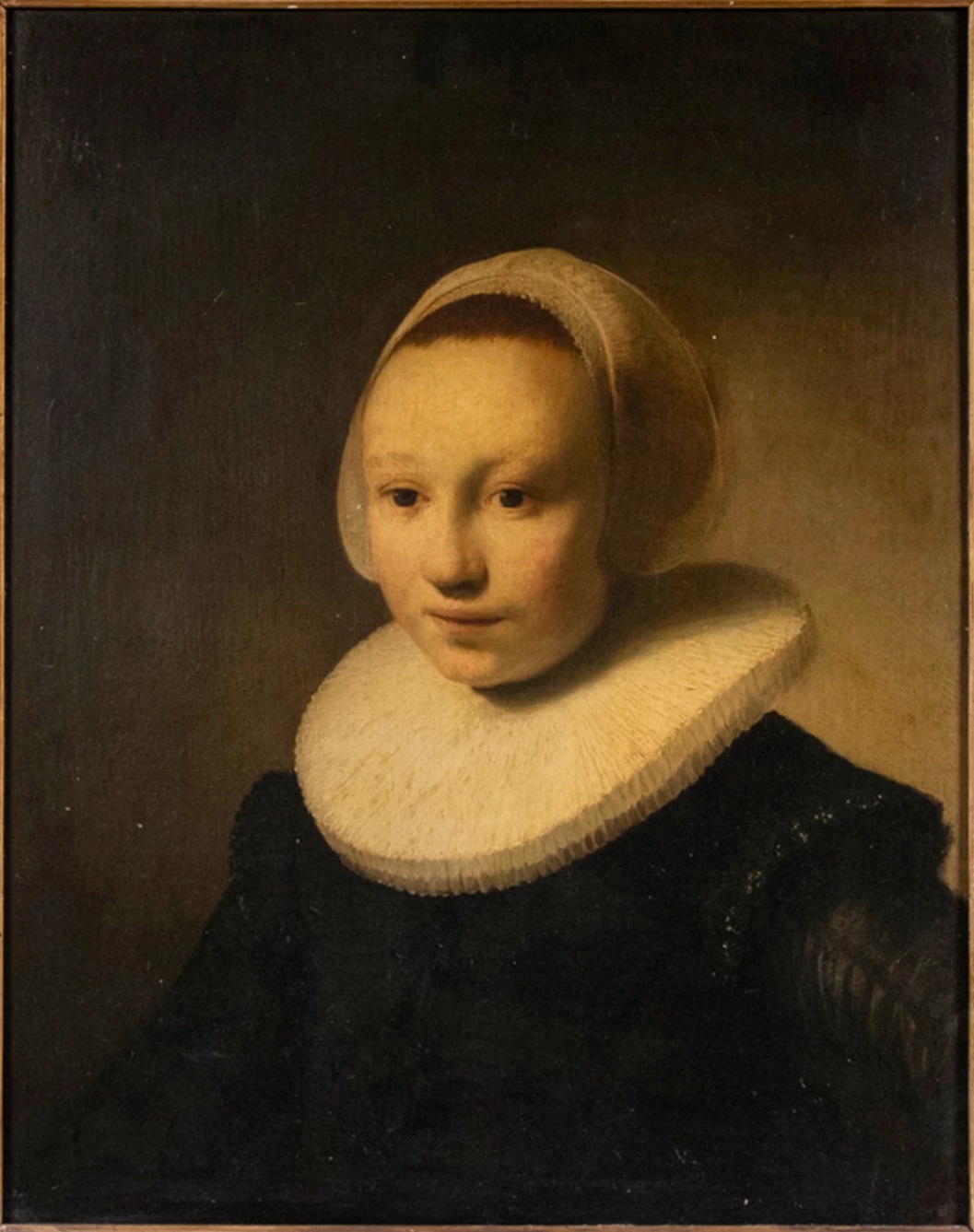 Portrait of a Girl, oil on cradled oak panel, about 56.4 by 44.5 cm, the panel found in a house in Camden, Maine, formerly in the collection of Cary W. Bok and now in a private collection in Europe. It was sold at Thomaston Place Auction Galleries, Thomaston, Maine, on 24 August 2024 as lot 2363, catalogued as after Rembrandt Harmenszoon van Rijn against an estimate of USD 10,000 to 15,000, at a hammer of USD 1,175,000. One hammer produced three published prices: USD 1,410,000, the hammer at the house's 20 per cent room rate and the figure in its own press release; USD 1,468,750, the hammer at its 25 per cent internet rate; and the bare hammer, rounded in local coverage to nearly USD 1.2 million. The attribution remains open.