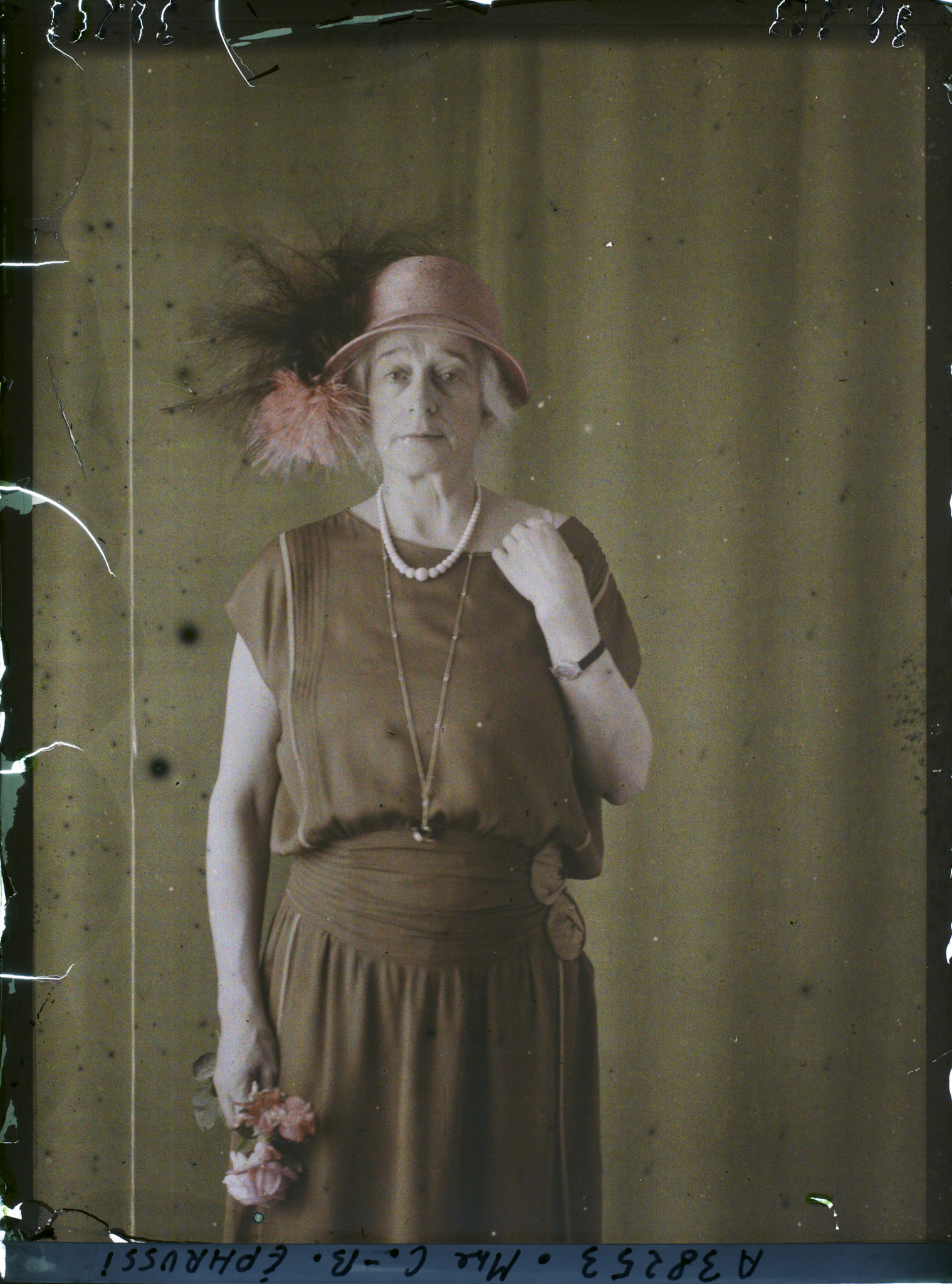 Charlotte-Beatrice Ephrussi, nee de Rothschild, photographed on 27 June 1923 on Albert Kahn's property at Boulogne. The plate is an autochrome on glass, 9 by 12 cm, and it is one of the few colour photographs of her. The museum record names the sitter; the records of what she bought largely do not survive.