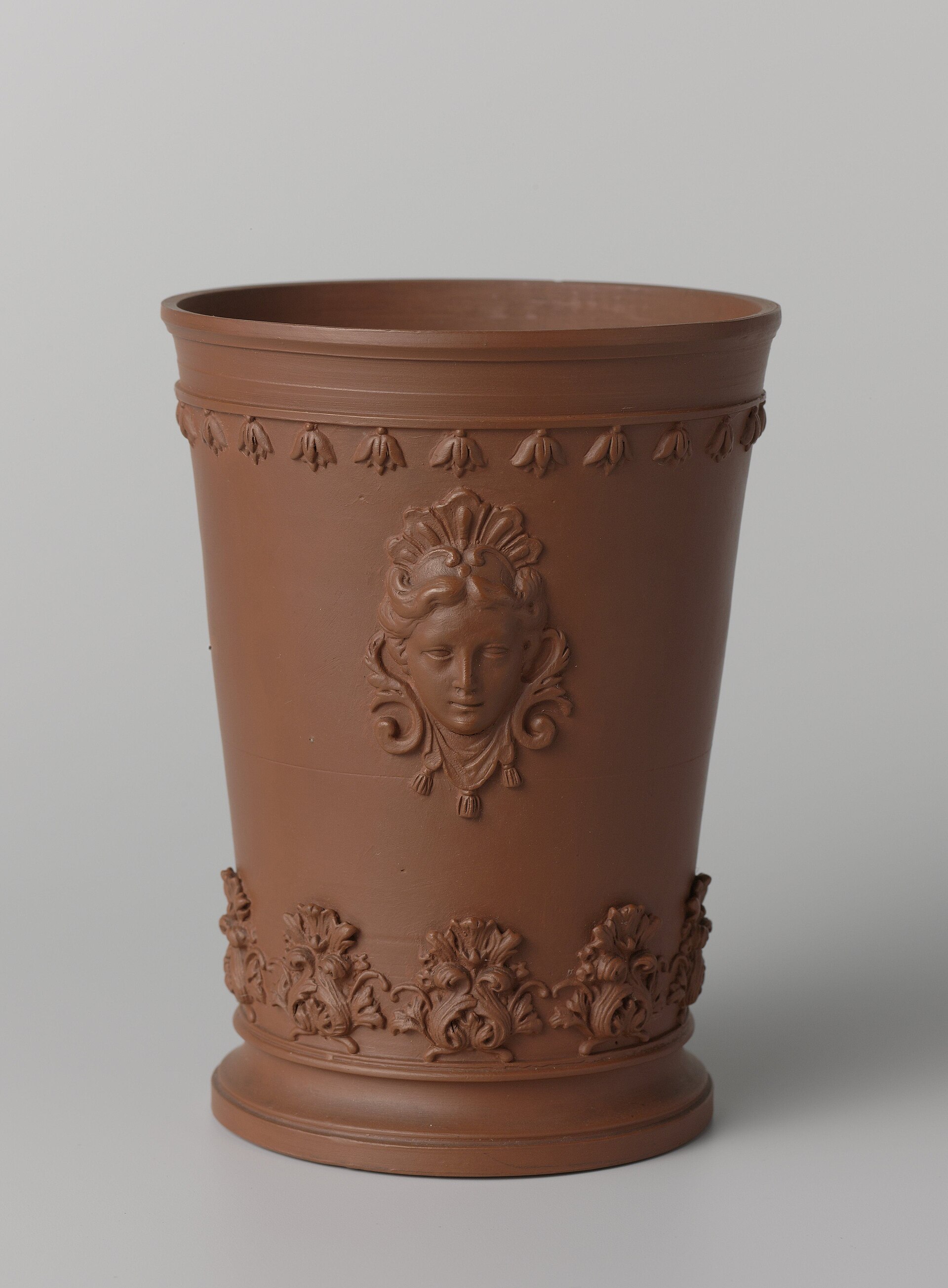 Beaker vase with women's heads in relief, about 1715