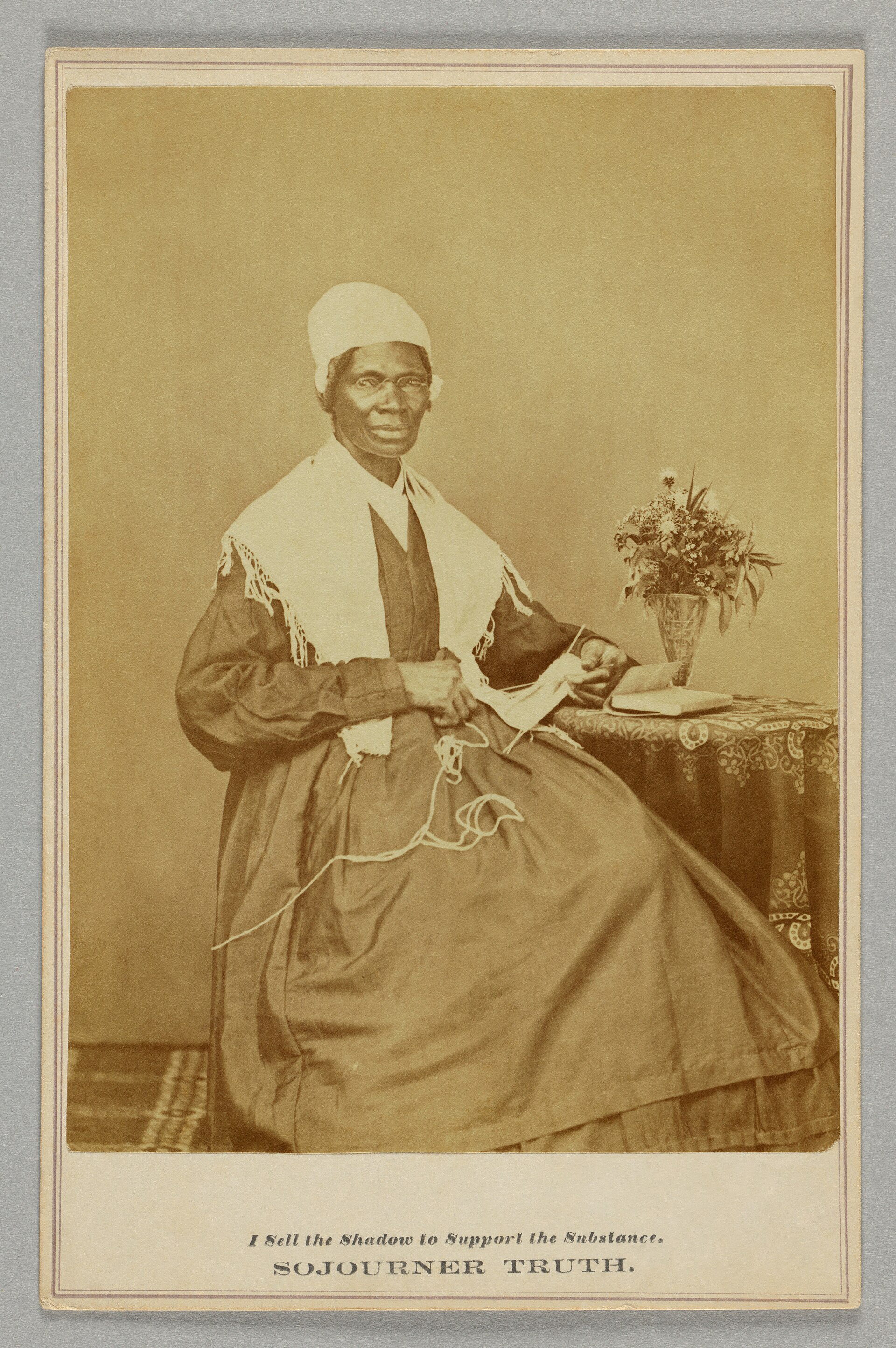 Cabinet card of the 1864 seated-with-knitting sitting, with a 1870 sale annotation