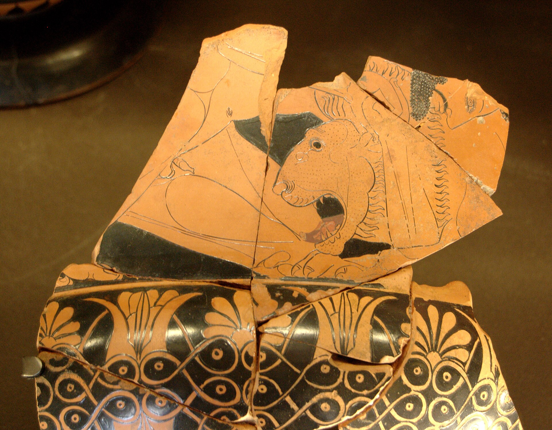 Fragmentary calyx-krater with Herakles and the Nemean lion, Louvre G 110