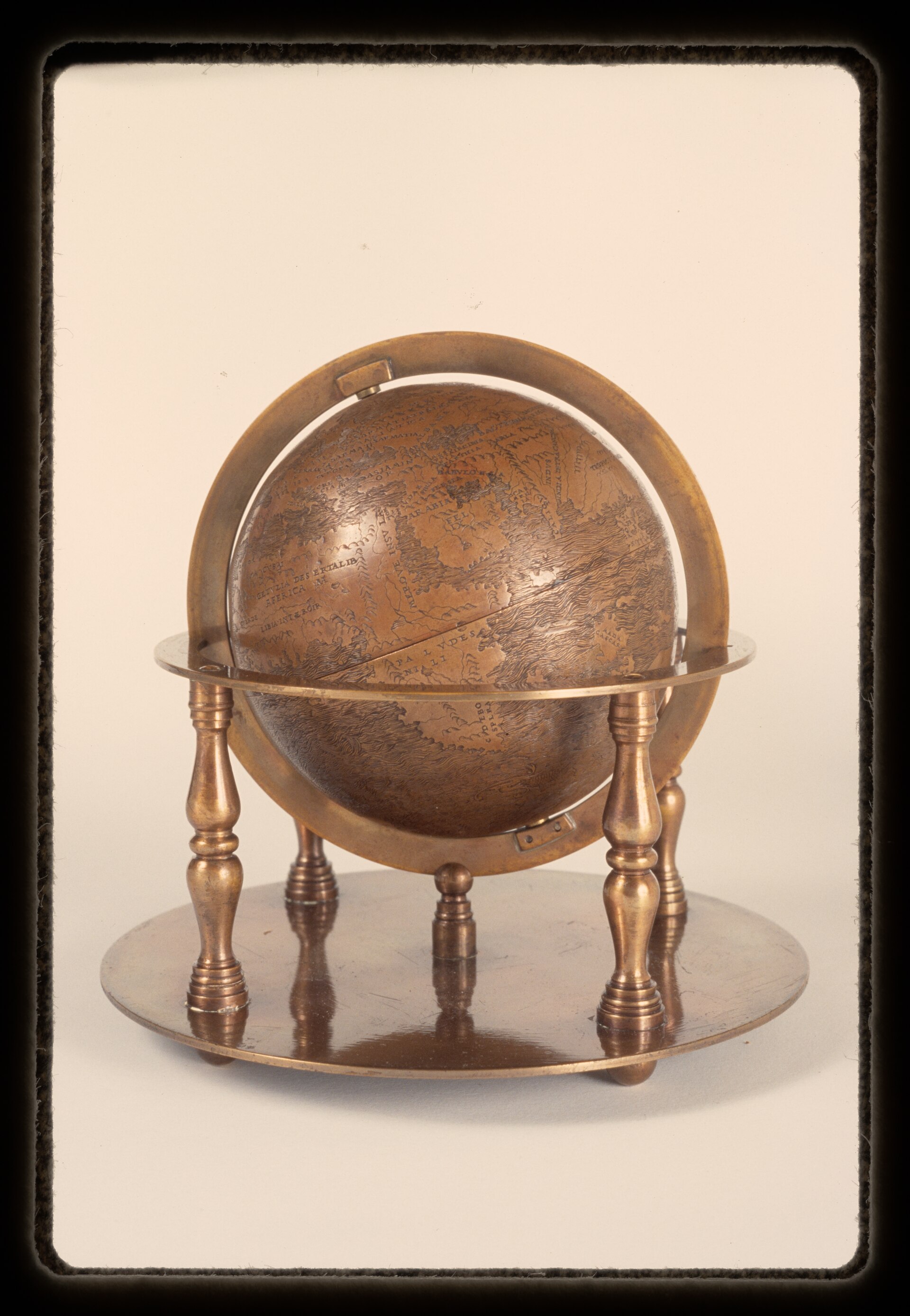 The Hunt-Lenox Globe, engraved copper, about 112 mm across, on a later brass stand. It entered the New York Public Library on 23 May 1895 not by purchase or gift but because the Lenox Library, which owned it, stopped existing that day and its assets passed into a new corporation.