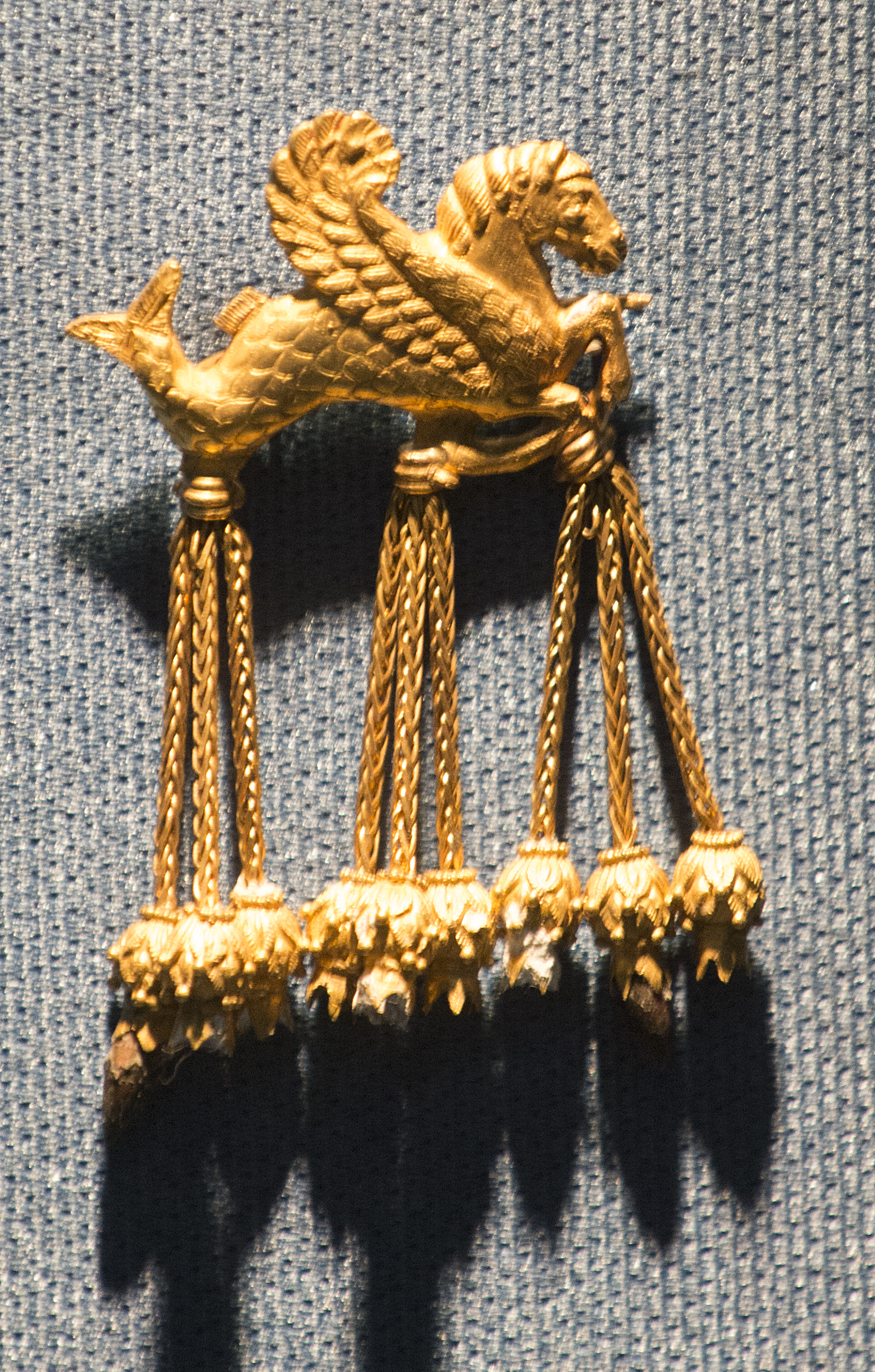 This is not the Lydian gold. It is the counterfeit winged hippocamp brooch that stood in the case at the Usak Museum in place of the real one, put there between about March and August 2005 and exposed in April 2006. The hoard's gap of 2005 to 2012 is seven years long, and it is a statement about the object rather than about the survival of archives. The test is never the length of a silence but its position and its edges.