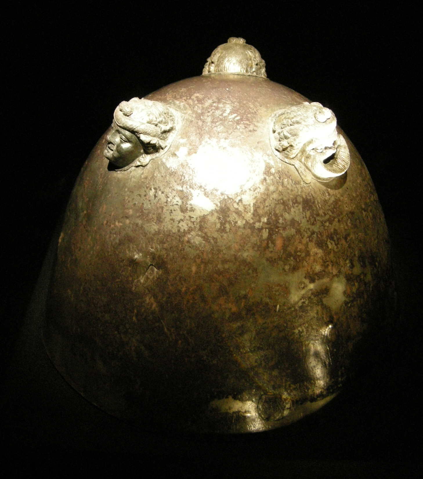 A Silver Vessel with Mask-Form Relief Attachments