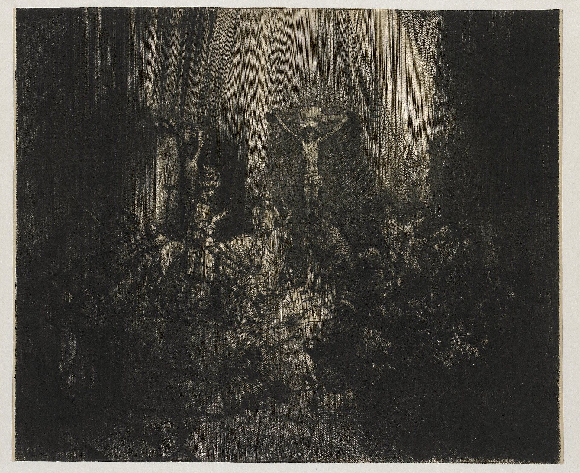 Rembrandt, Christ Crucified between the Two Thieves, known as The Three Crosses, state IV of 5, drypoint on Japanese paper. Rijksmuseum RP-P-1962-40. The impression carries an unidentified collector's stamp catalogued as Lugt 228; the stamp is not legible at this reproduction size.