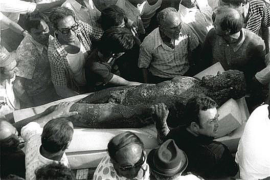 A crowd around one of the bronzes after the recovery