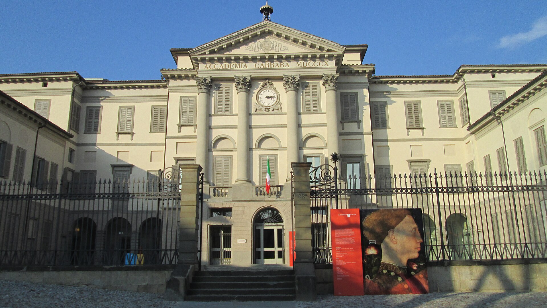 The full facade behind its railings
