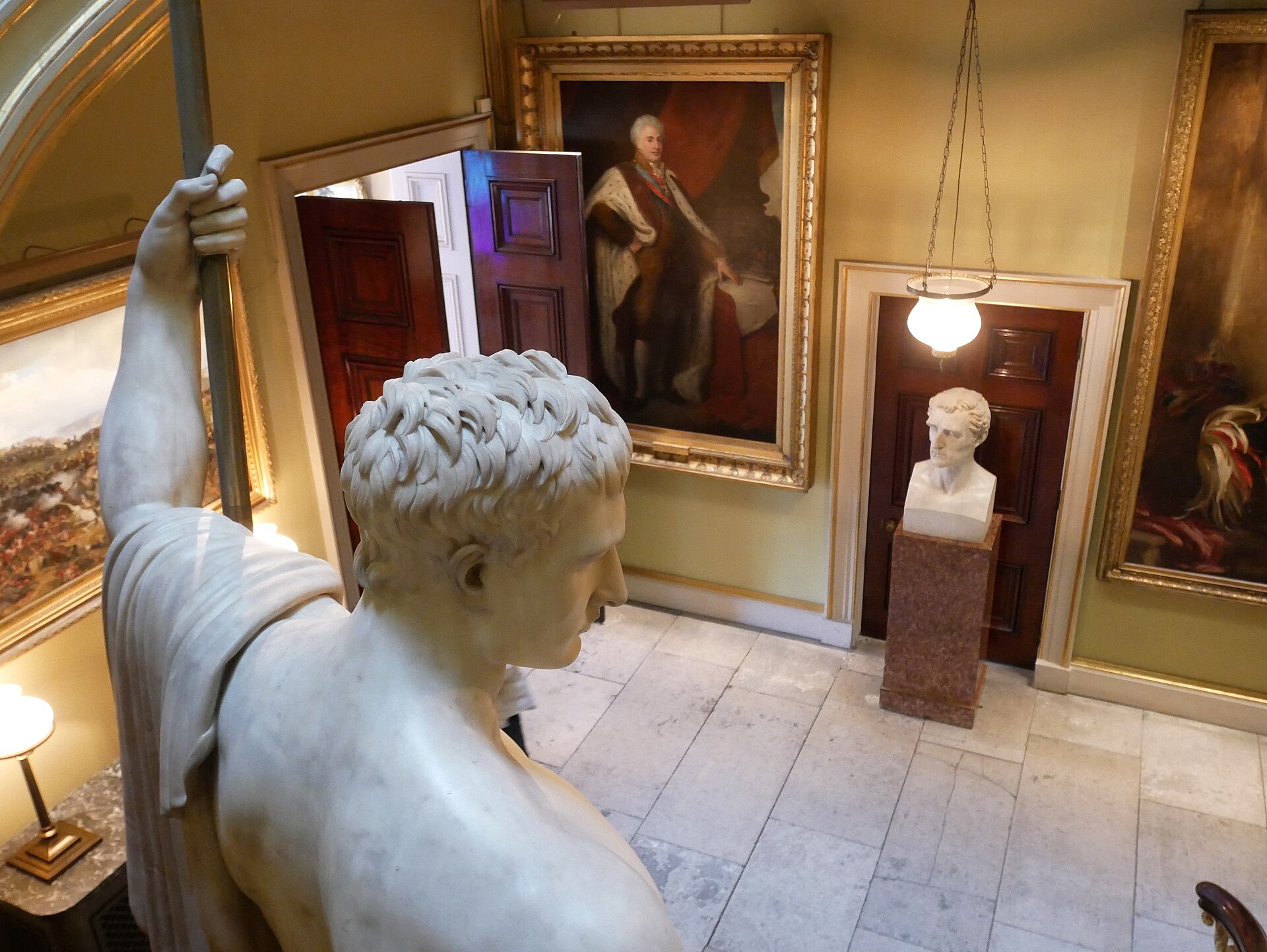 Canova's marble statue of Napoleon as Mars the Peacemaker at the foot of the grand staircase, Apsley House