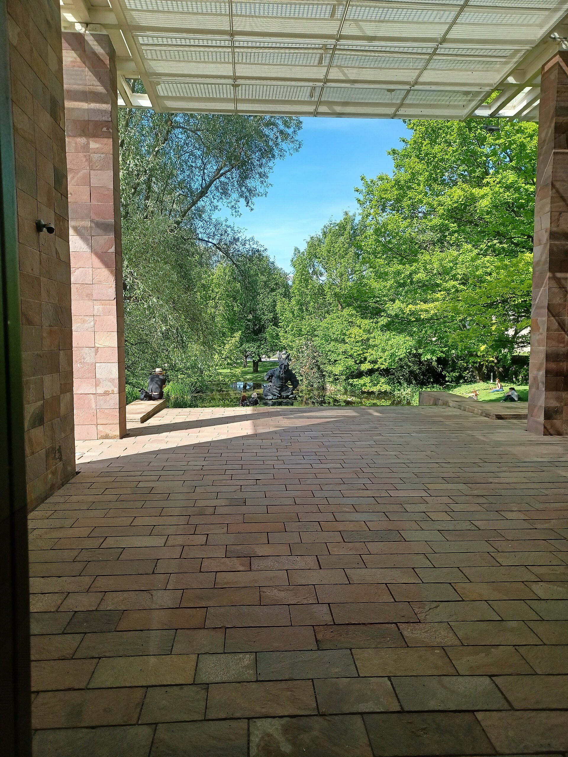 The reflecting pond in Berower Park, seen from beneath the museum's garden colonnade
