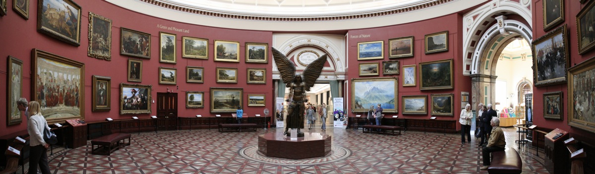 The Round Room, its red walls hung with paintings around Jacob Epstein's bronze Lucifer