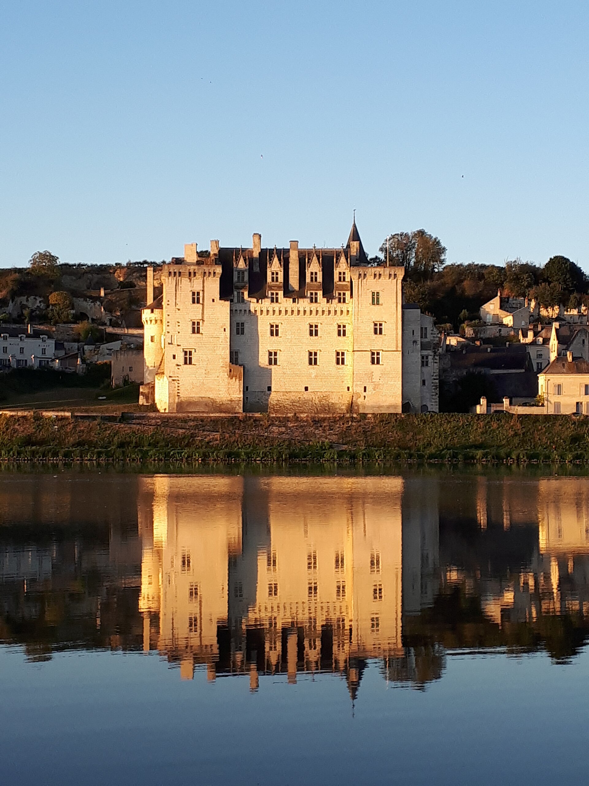 The chateau at dusk, reflected in the Loire