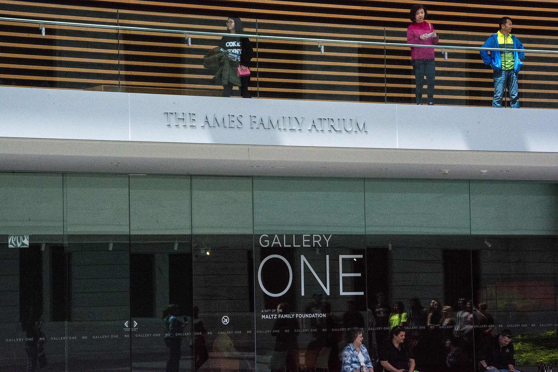 The Ames Family Atrium, with its name lettered above the balcony and the entrance to Gallery One below
