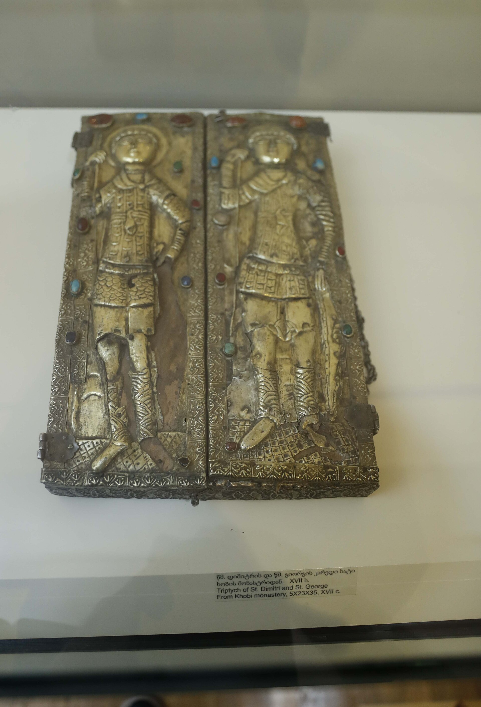 Silver-gilt triptych of Saint Demetrios and Saint George from Khobi Monastery, on display in a glass case in the Christian Arts collection