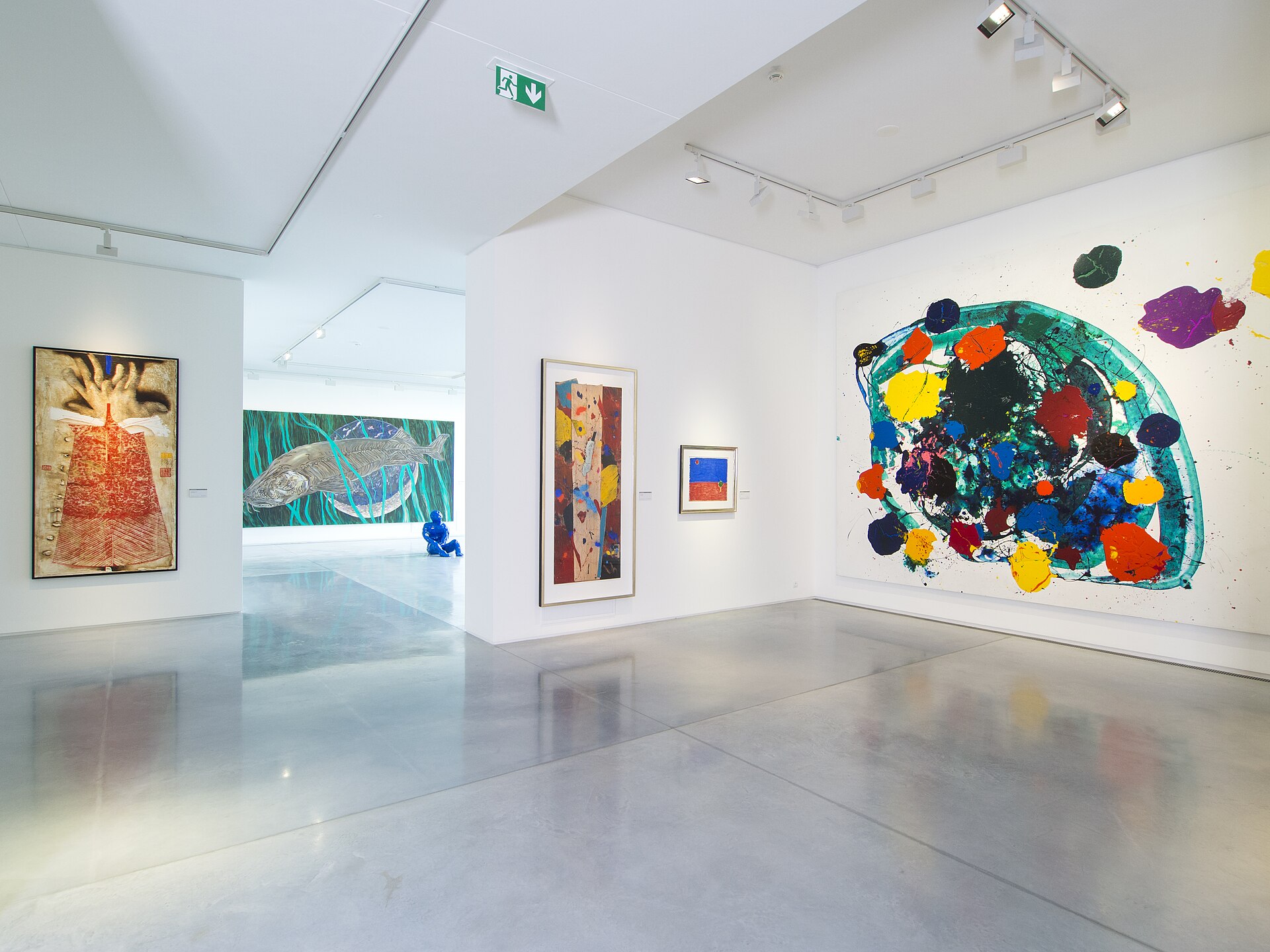 A gallery of the Meulensteen collection, with a large abstract painting on the end wall and the Danube visible through the glass facade.