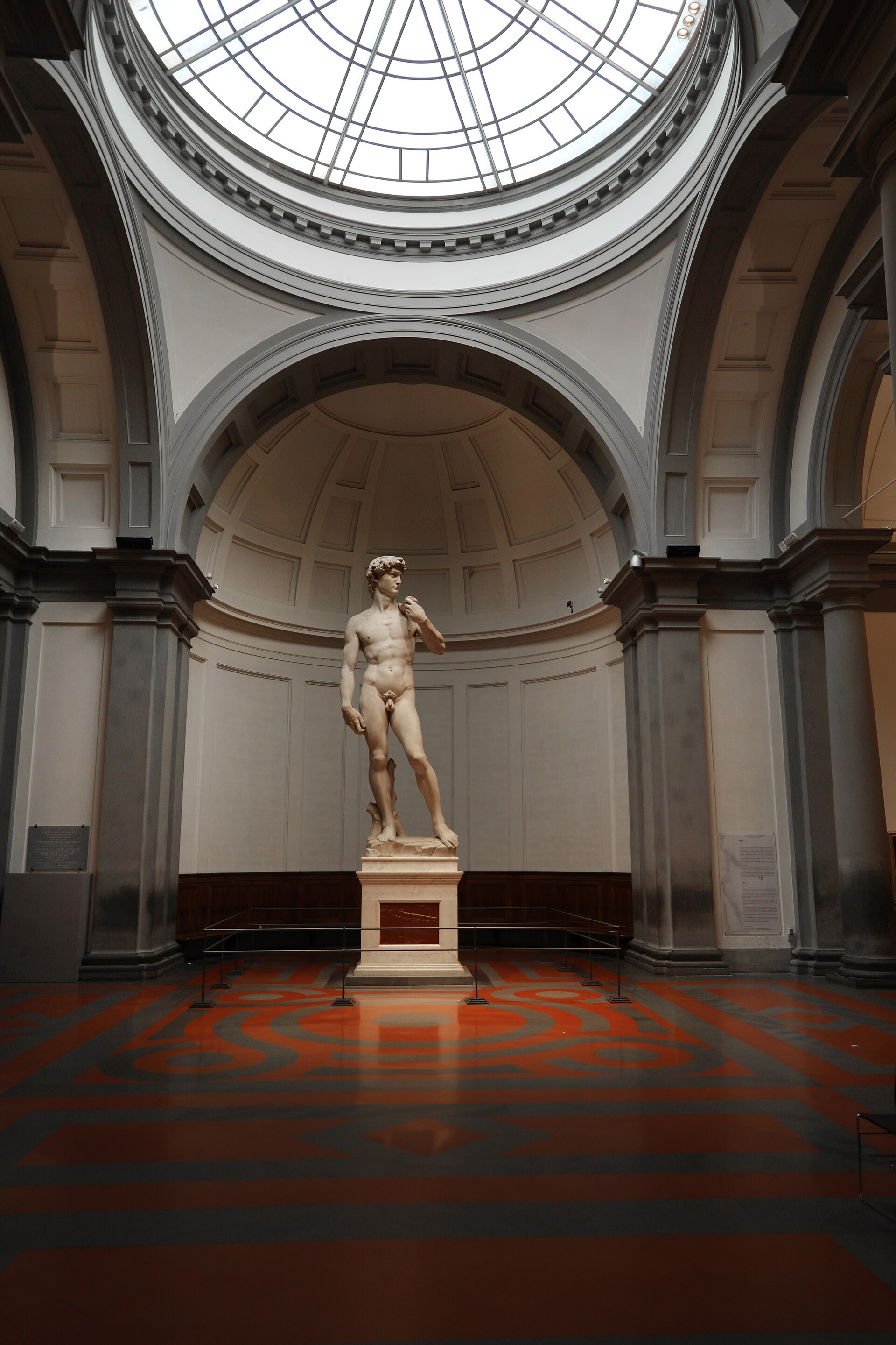 Michelangelo's David under the skylight dome of the Tribuna, designed by Emilio De Fabris to hold the statue after its 1873 move from Piazza della Signoria
