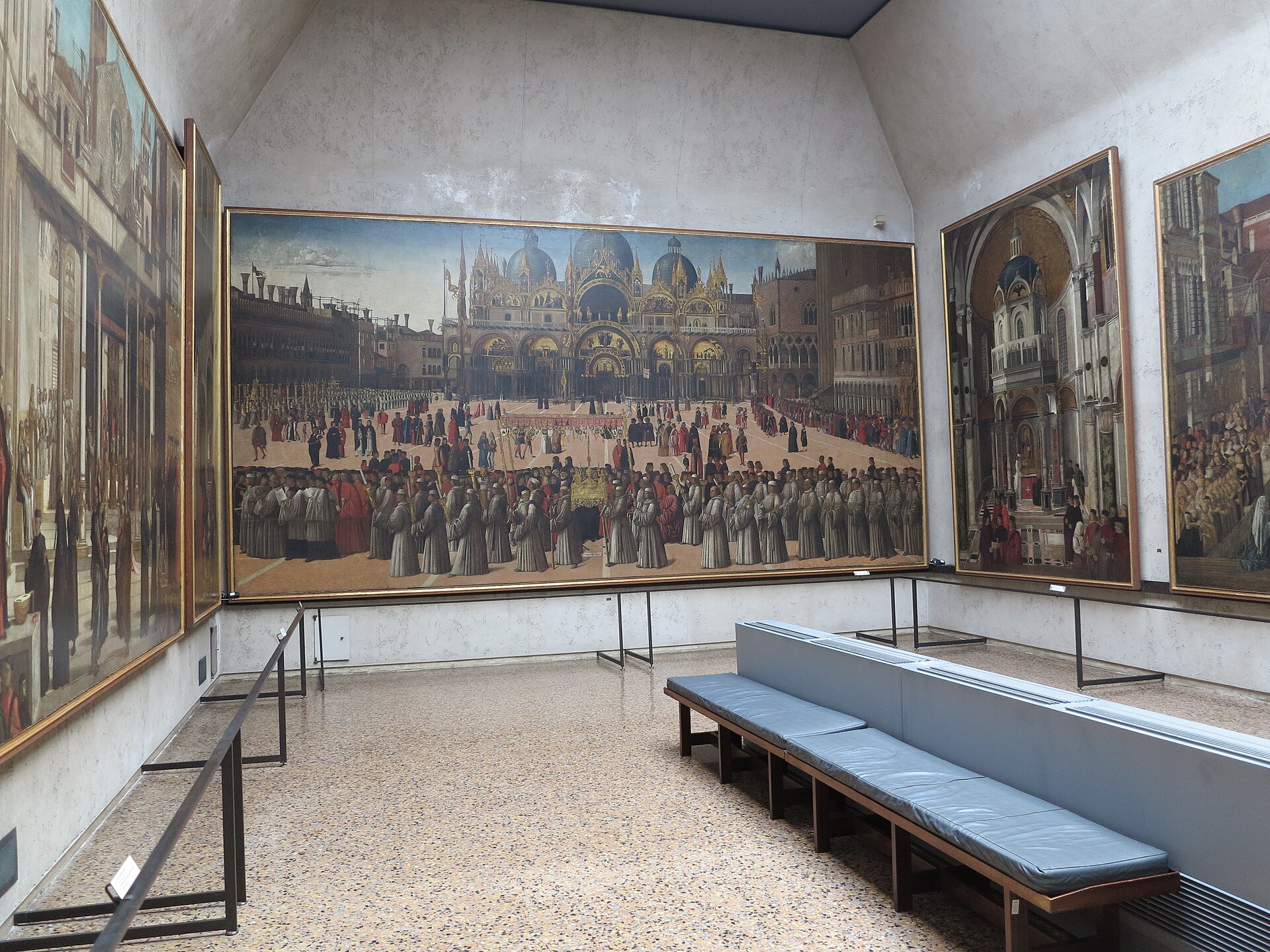 The Room of the Stories of the Relic of the Cross, showing Gentile Bellini's Procession in Piazza San Marco and adjoining canvases from the same cycle, photographed before the room's current restoration closure
