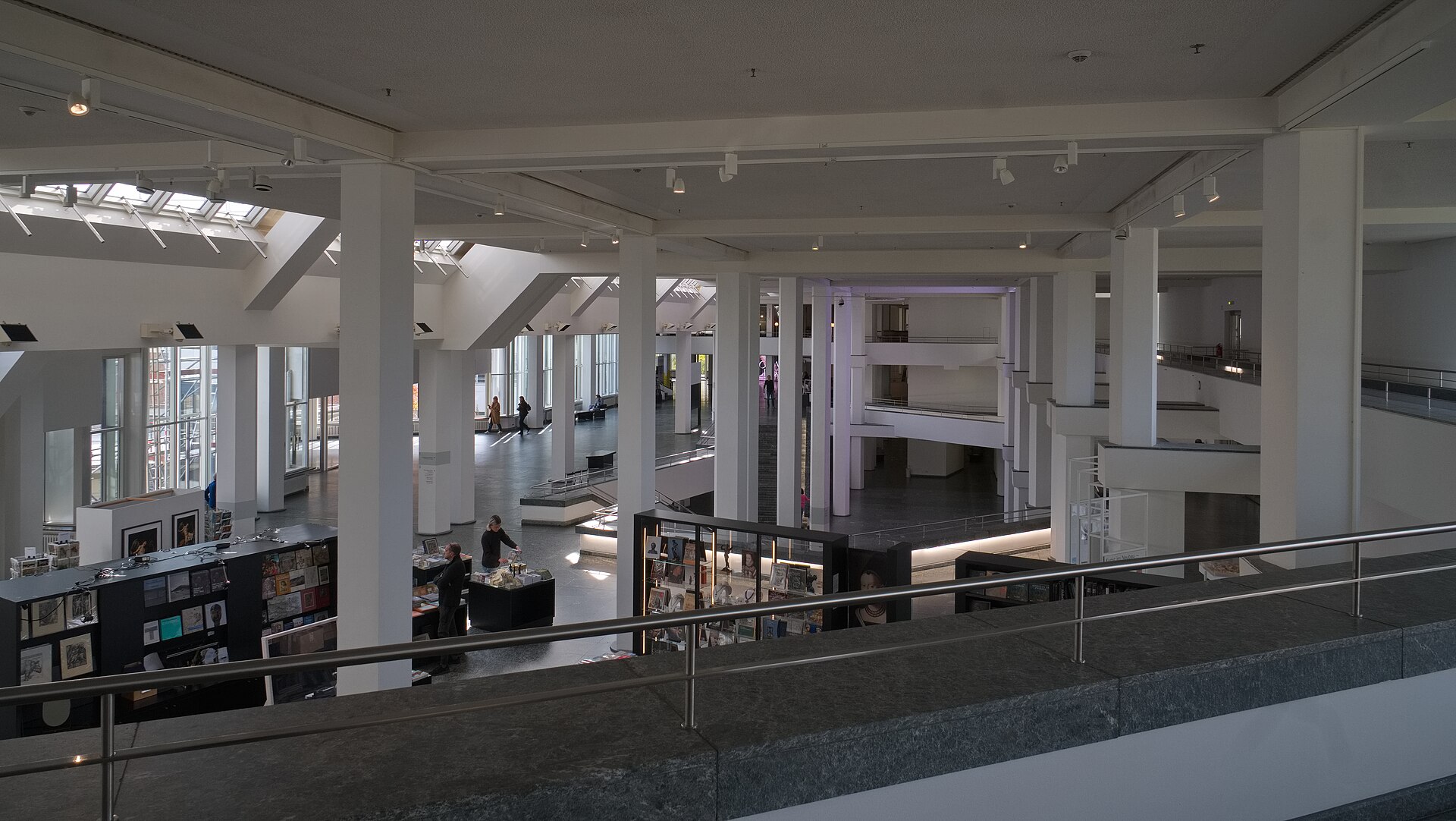 The shared Kulturforum foyer seen from the first-floor gallery, with the bookshop below