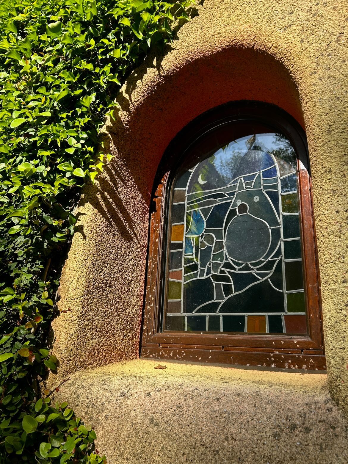 Stained-glass window depicting Totoro at the Ghibli Museum entrance