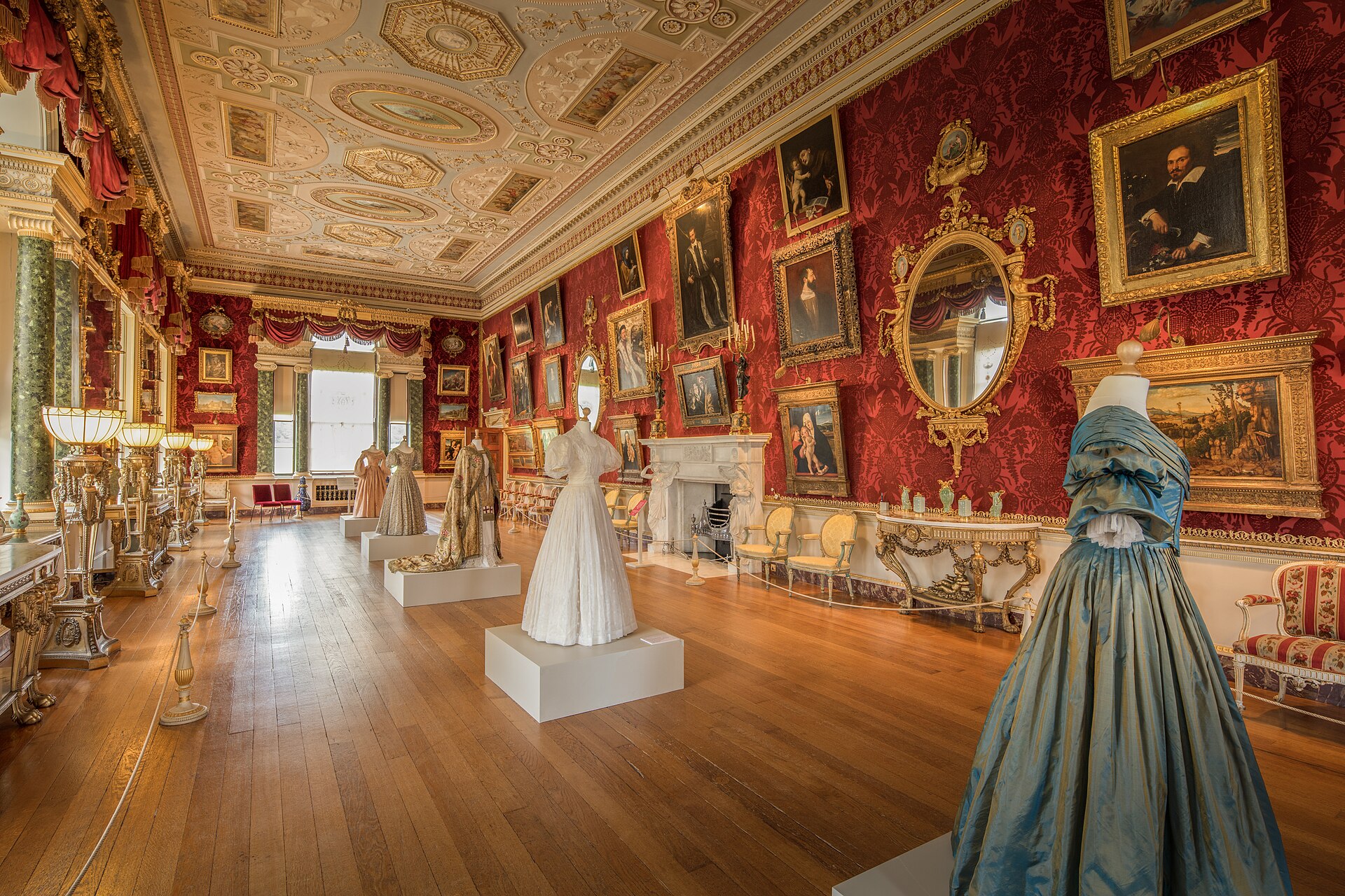 The Gallery, hung with portraits and dressed with costume on mannequins
