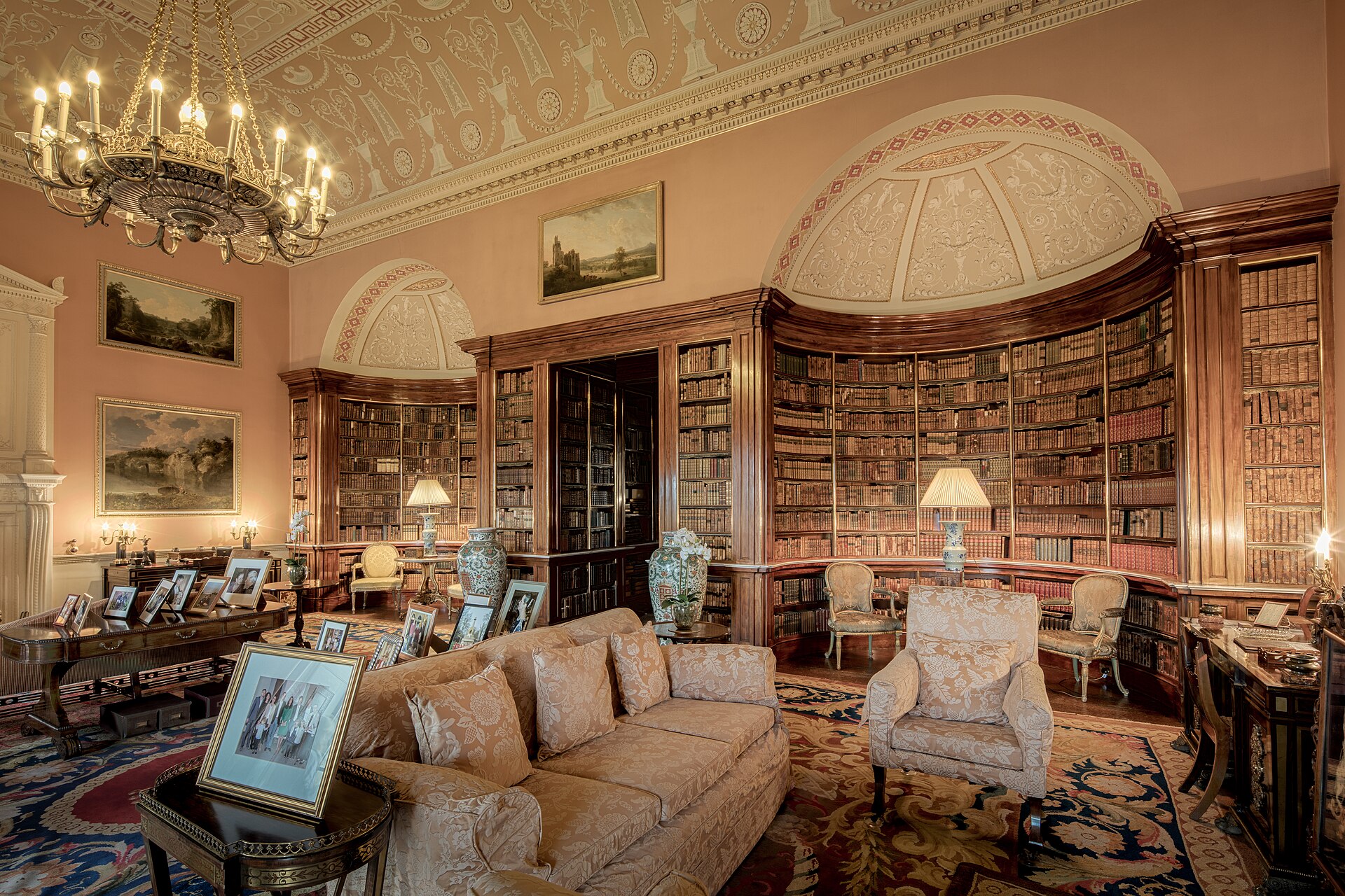 The Main Library, with shelved books, portraits and seating