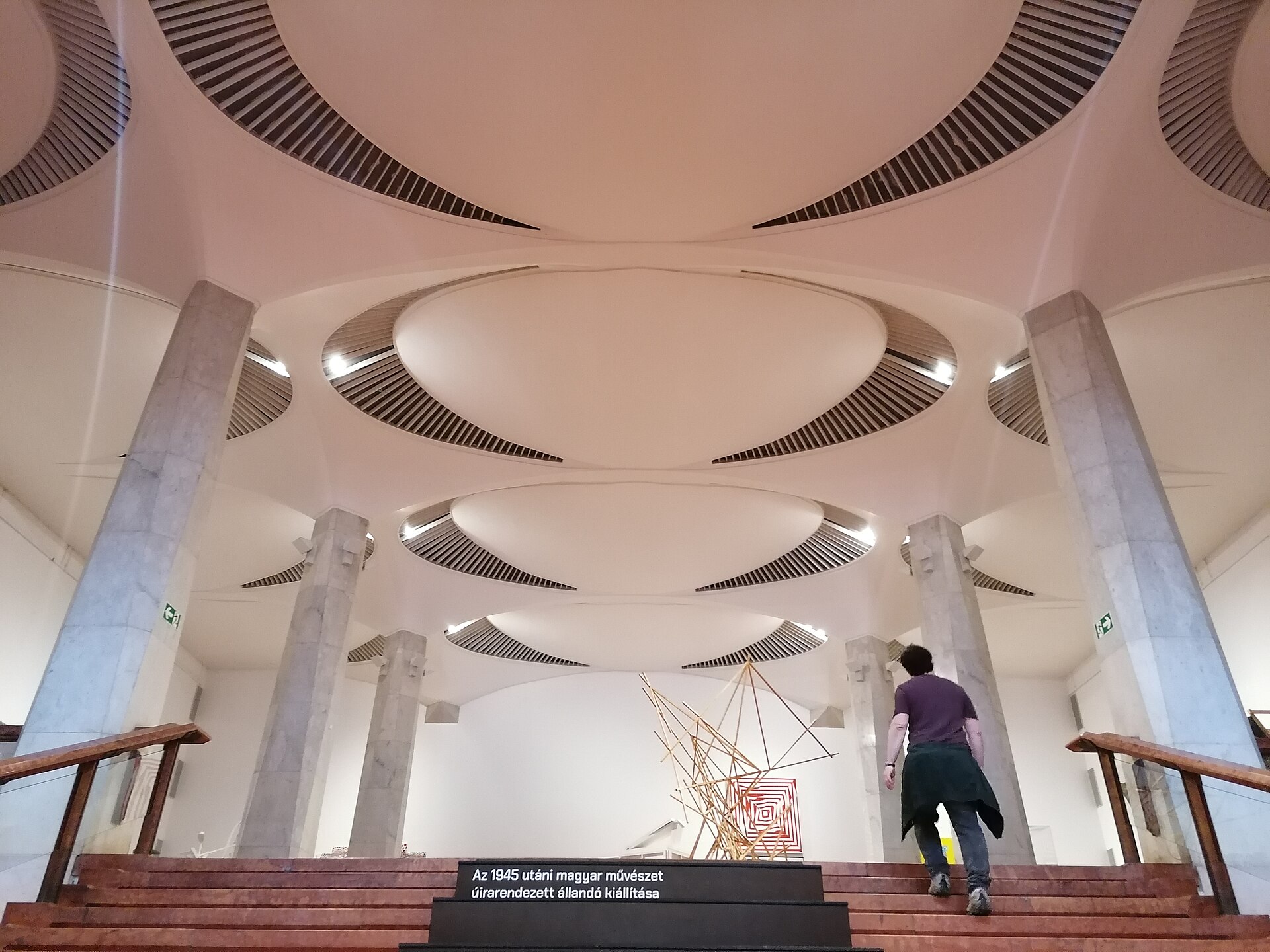 The entrance to the permanent exhibition on Hungarian art after 1945, with its wall text visible in Hungarian, inside the Hungarian National Gallery