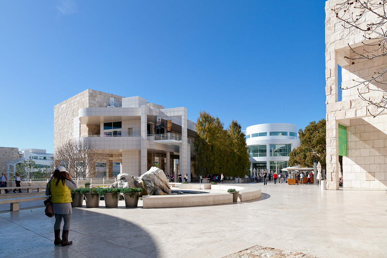 The arrival plaza at the Getty Center, with two of the travertine-clad gallery pavilions and a fountain