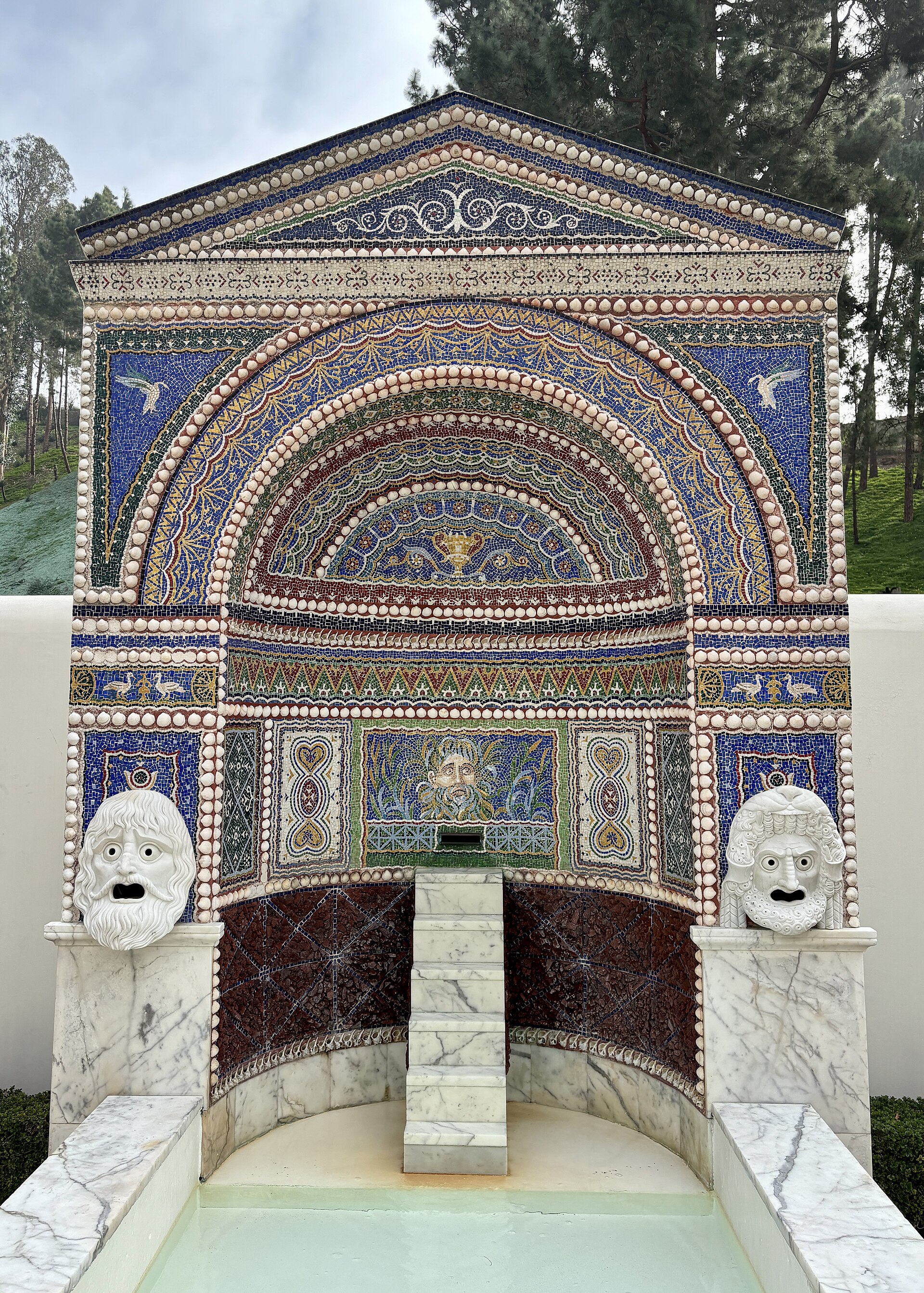 The mosaic and shell niche fountain in the Getty Villa's garden, photographed in December 2025 after the site reopened