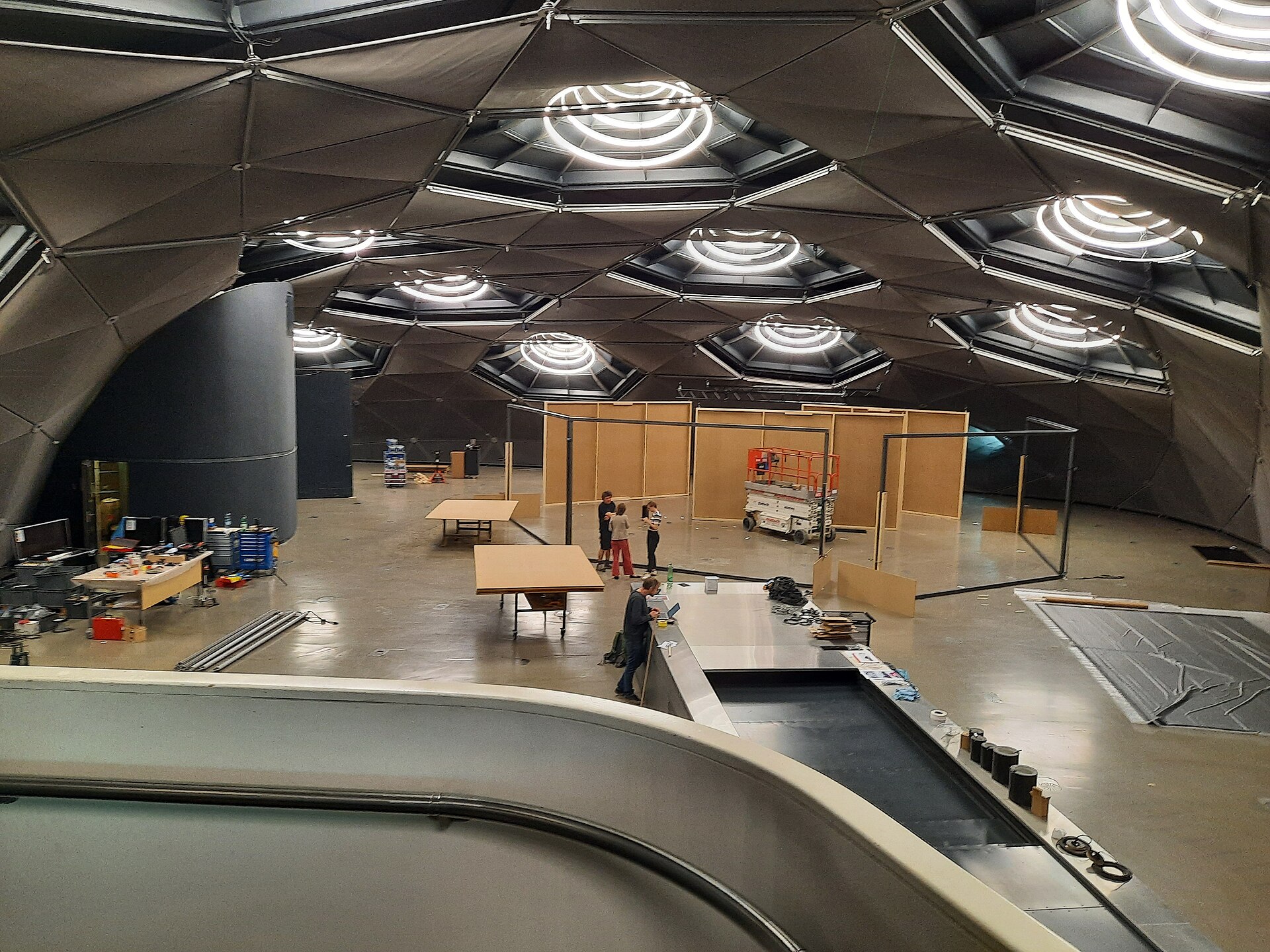 Inside Space01, the Kunsthaus Graz's upper exhibition hall, showing the nozzle skylights built into the biomorphic shell during an exhibition changeover