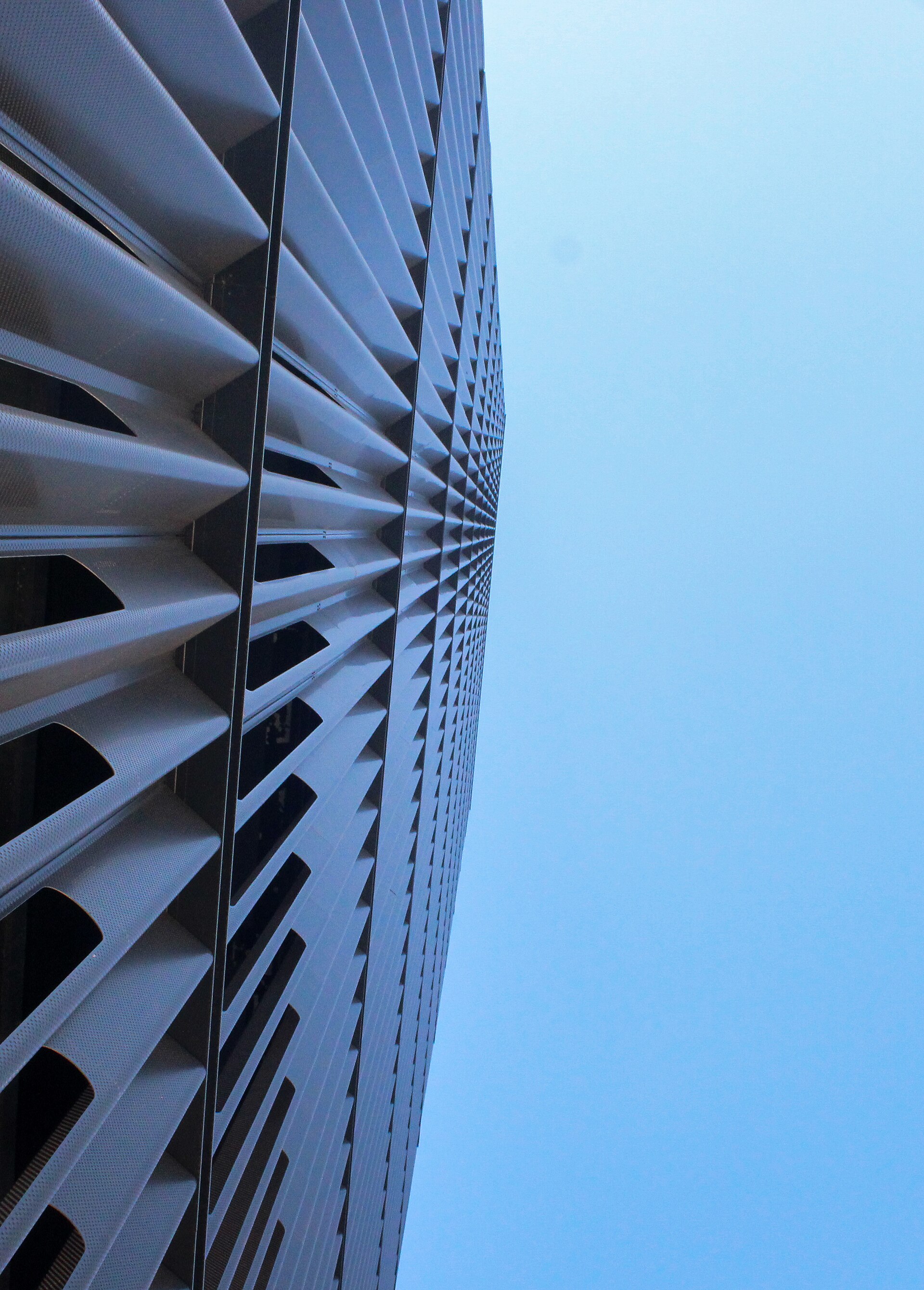 The pleated and perforated panel cladding of the Pietro Maria Bardi building, seen looking up the facade
