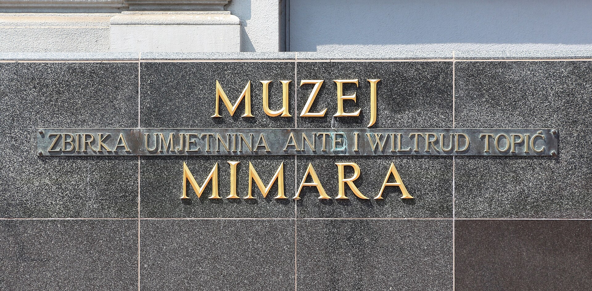 Museum name carved into the facade