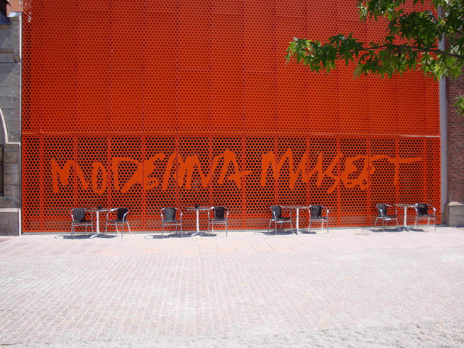Detail of the perforated red facade