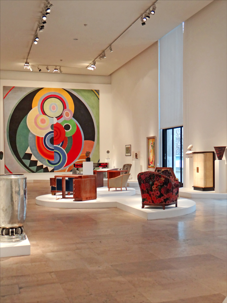 The Art Deco gallery, with 1930s furniture set beneath a large circular Robert Delaunay-school painting