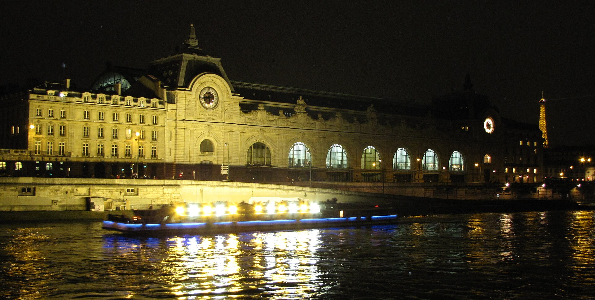 The museum at night, seen across the Seine