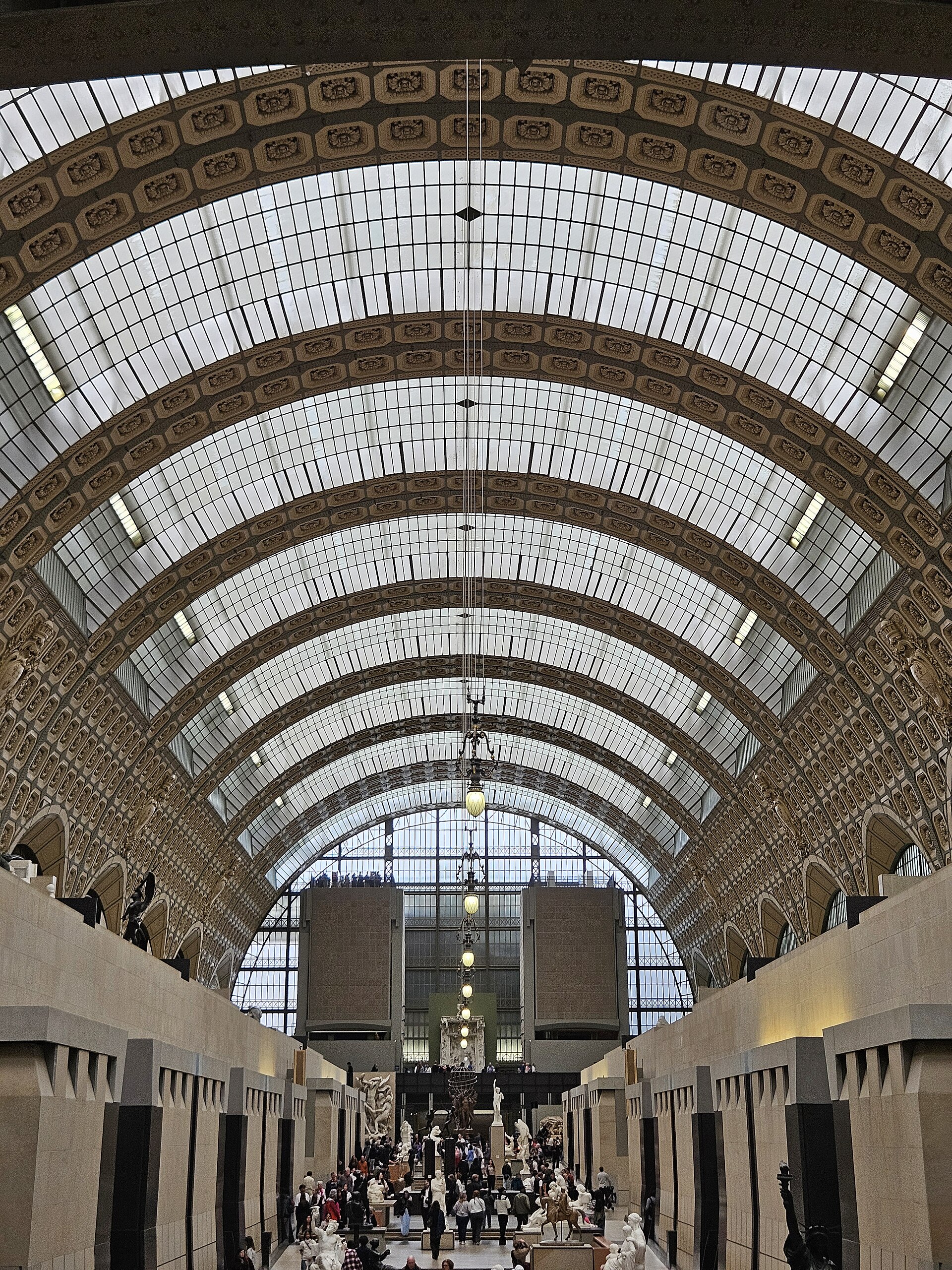 The barrel-vaulted glass roof of the former station hall, seen from the nave floor
