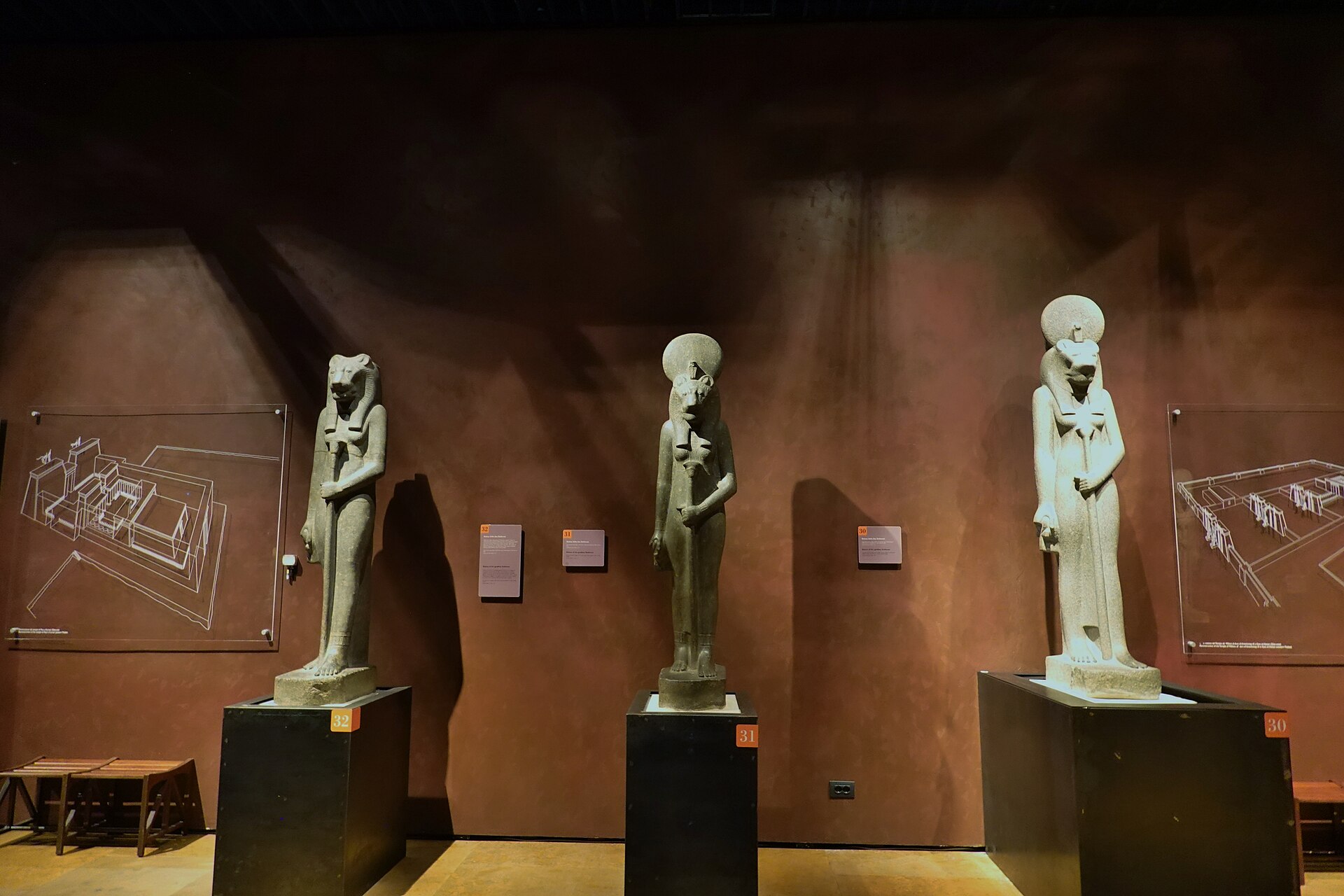Statues of Sekhmet and other deities lit dramatically in the Gallery of the Kings, redesigned by Dante Ferretti in 2006