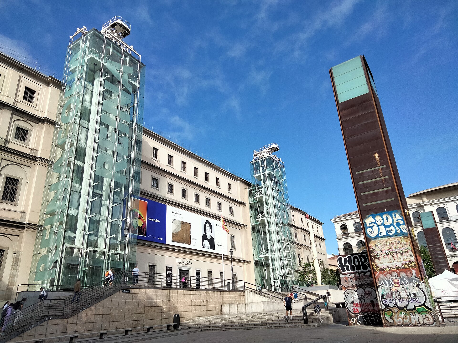 Glass towers and Calle Santa Isabel facade