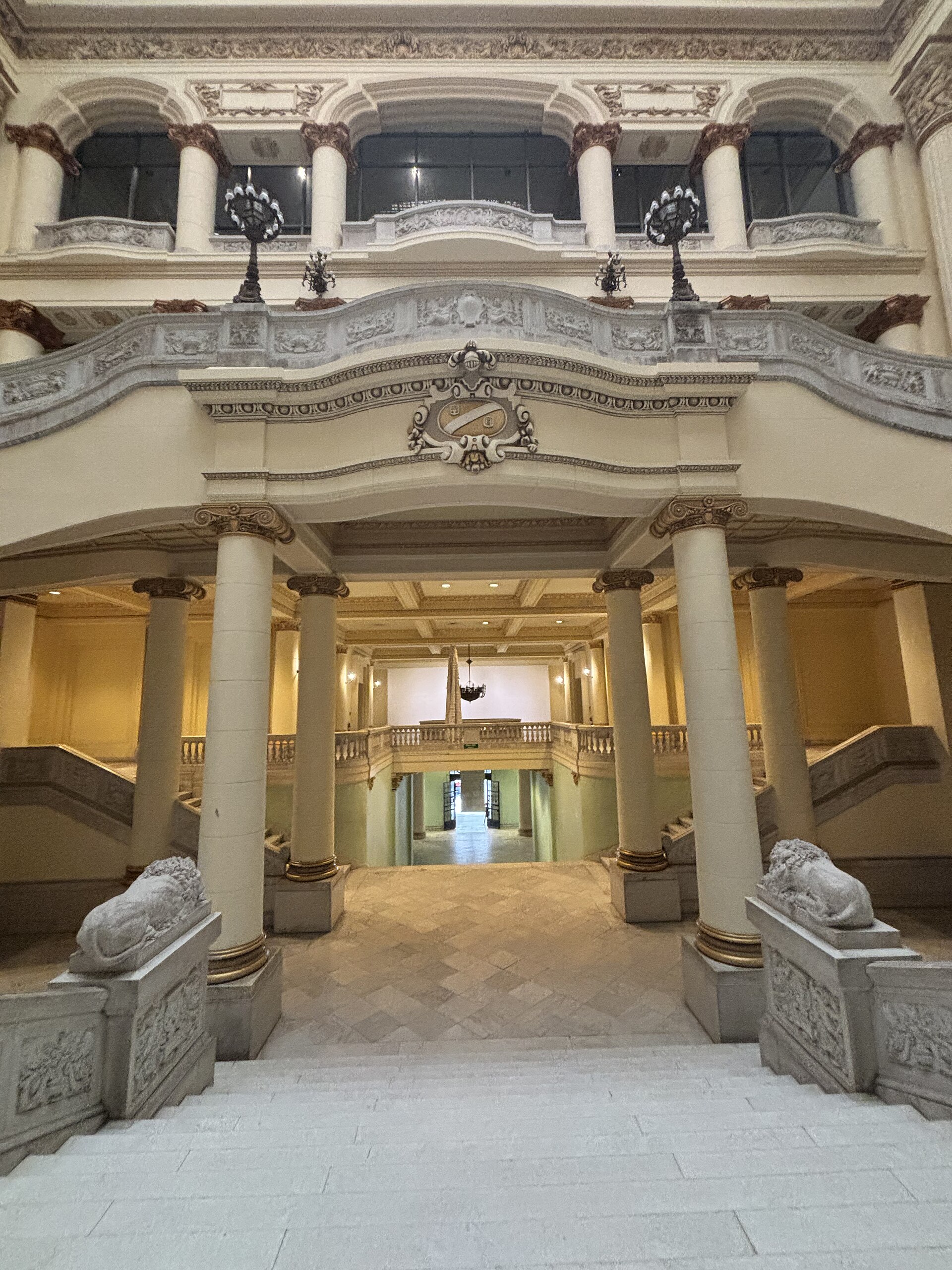 The domed double staircase and stained-glass ceiling inside the Palacio del Centro Asturiano