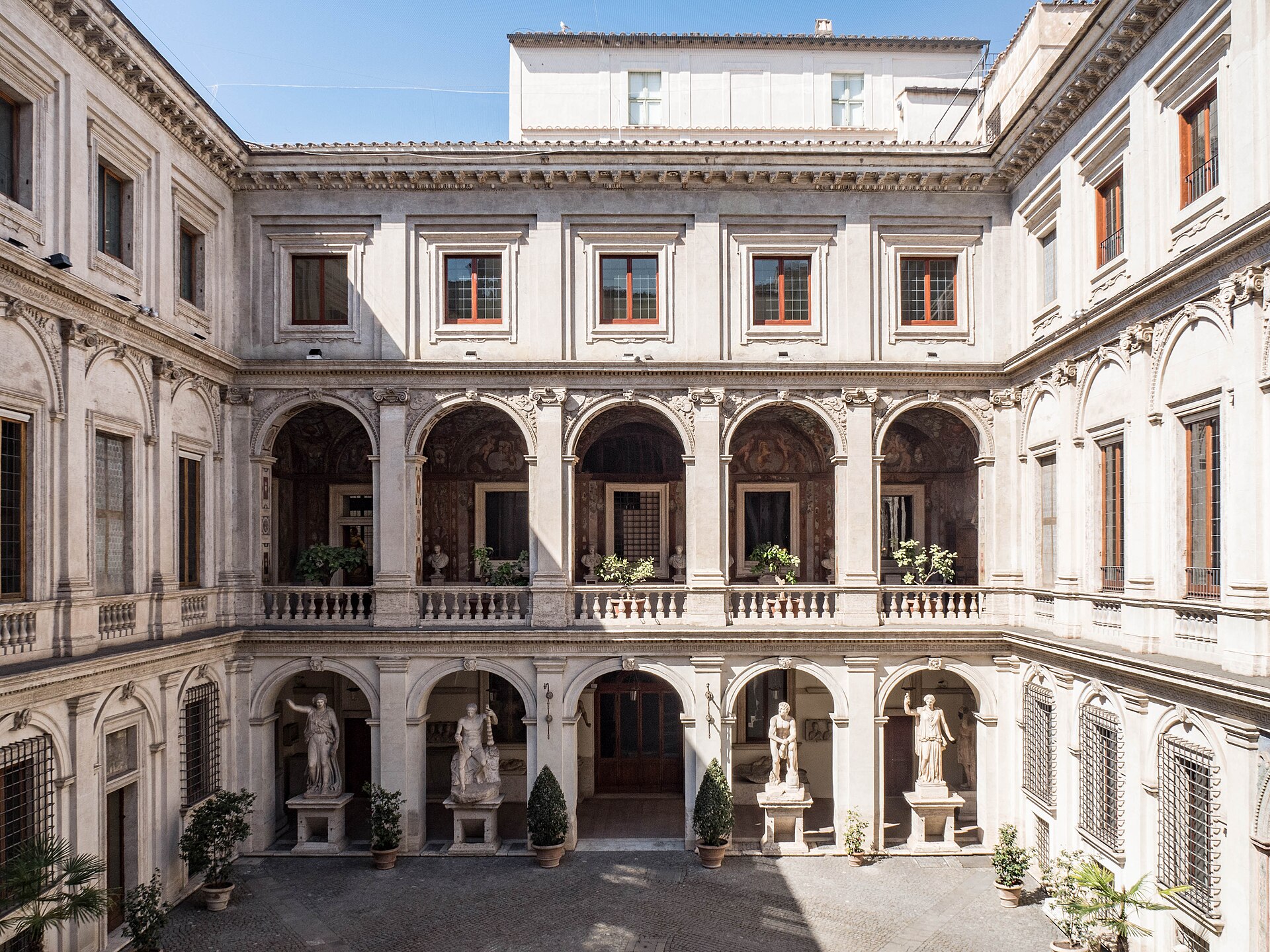The arcaded Renaissance courtyard of Palazzo Altemps, with ancient statues displayed in the loggia