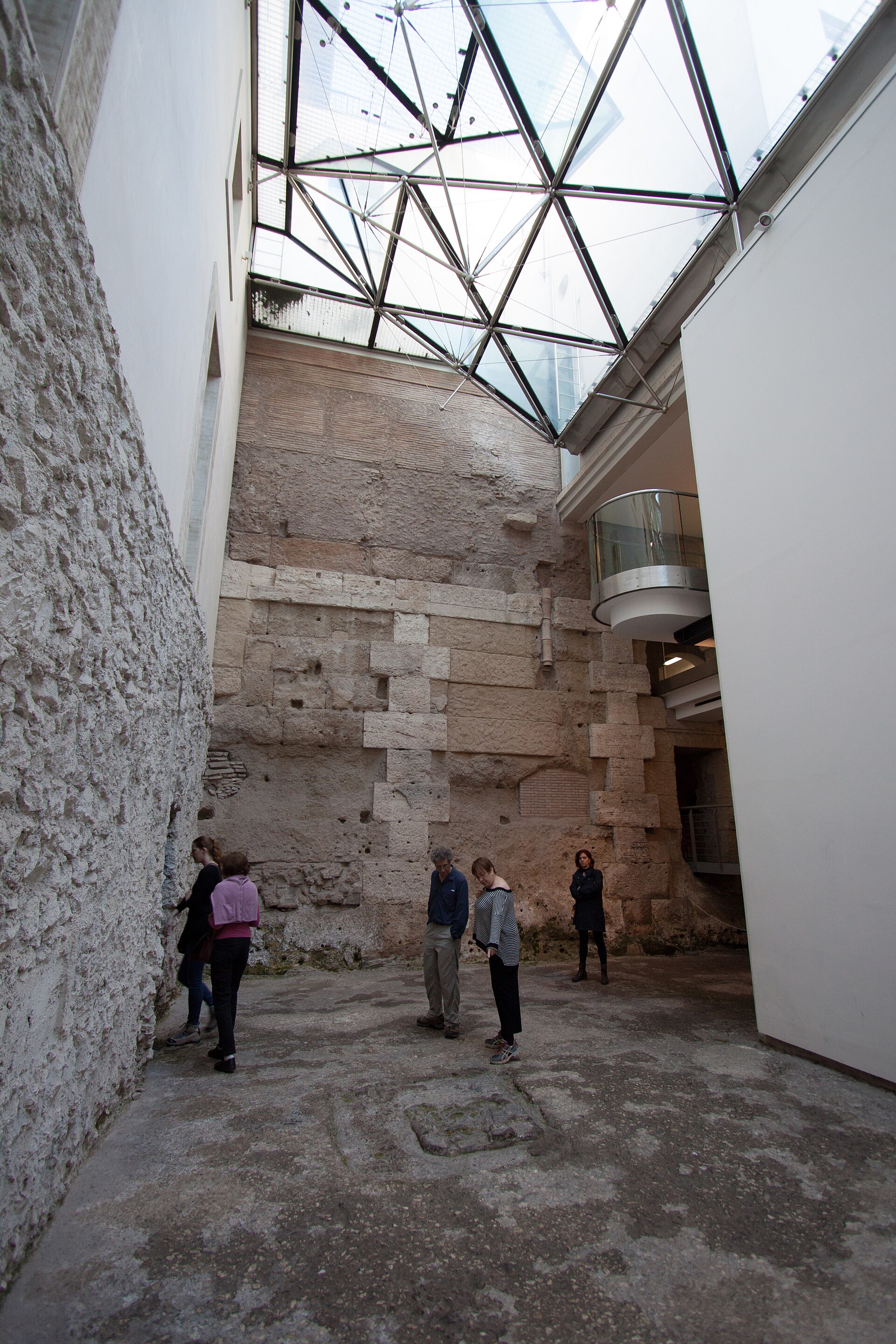The internal courtyard of the Crypta Balbi, with ancient masonry visible beneath a modern glazed roof, photographed before the site's current closure