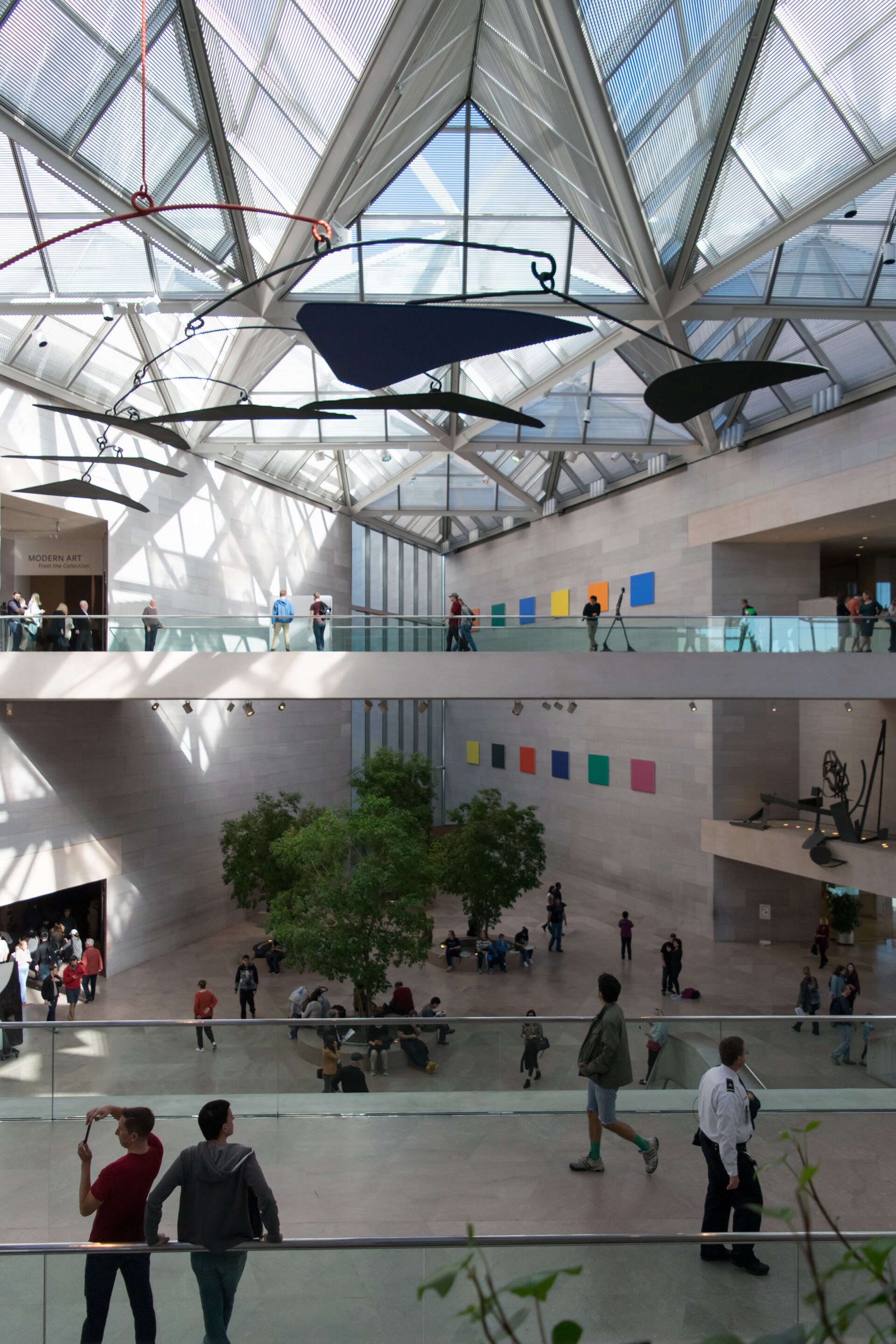 The East Building Atrium, skylit, with Alexander Calder's mobile hanging over the open central space