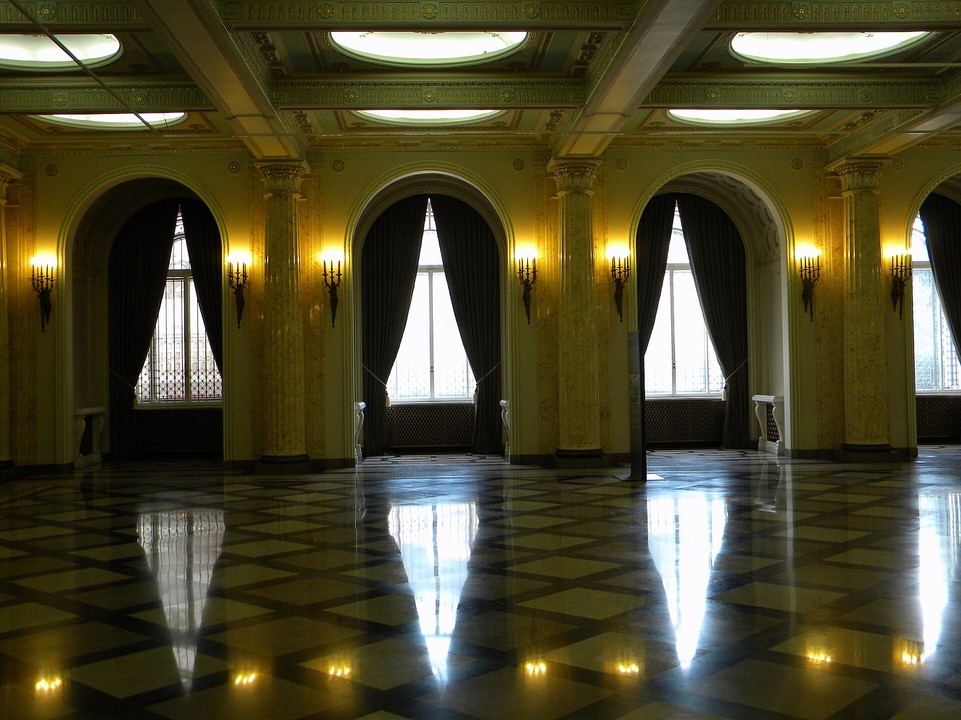 A marble-columned anteroom of the Royal Palace's historic state rooms, part of the route to the Throne Room