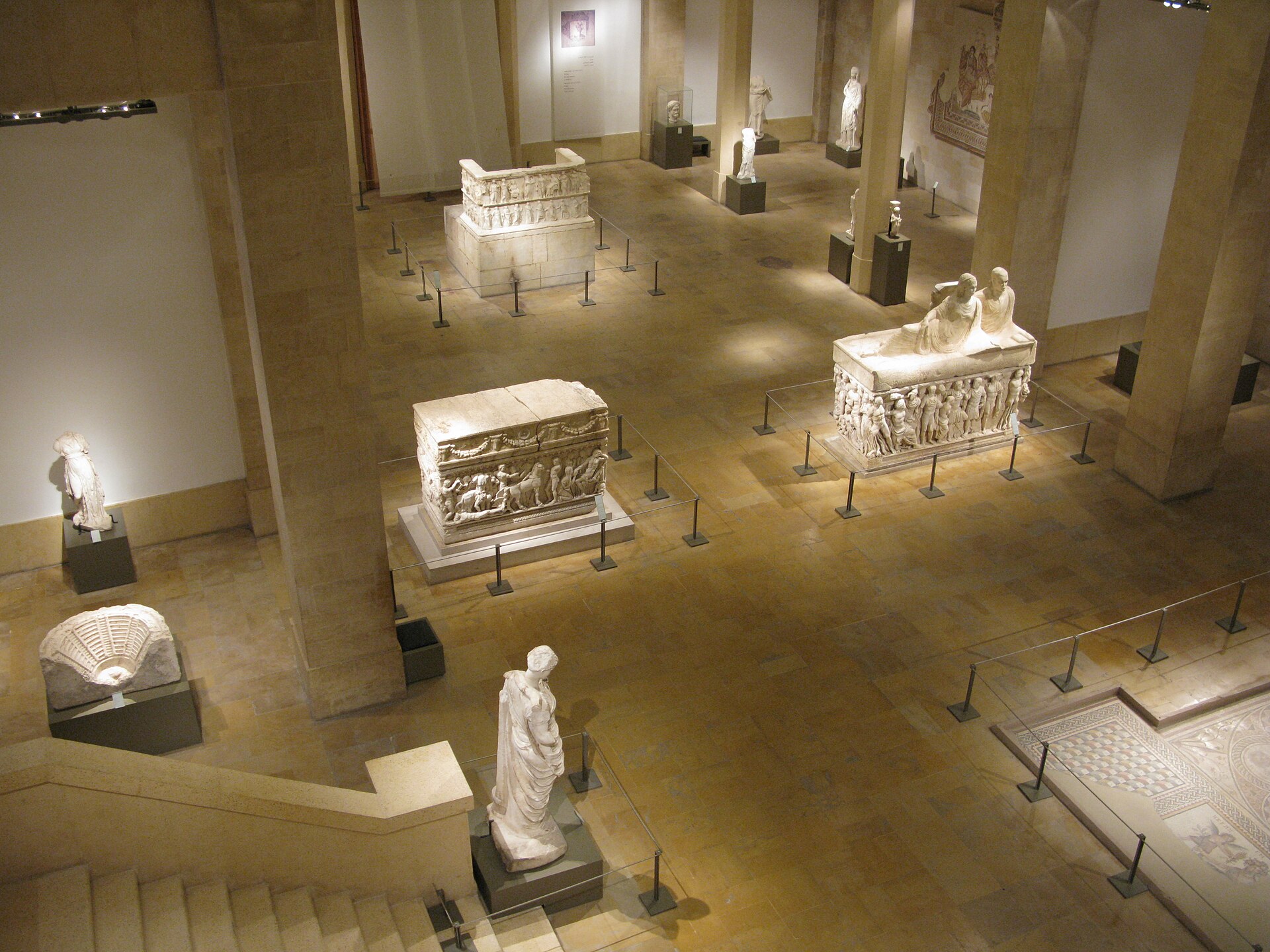 Elevated view of the ground floor toward the basement stair