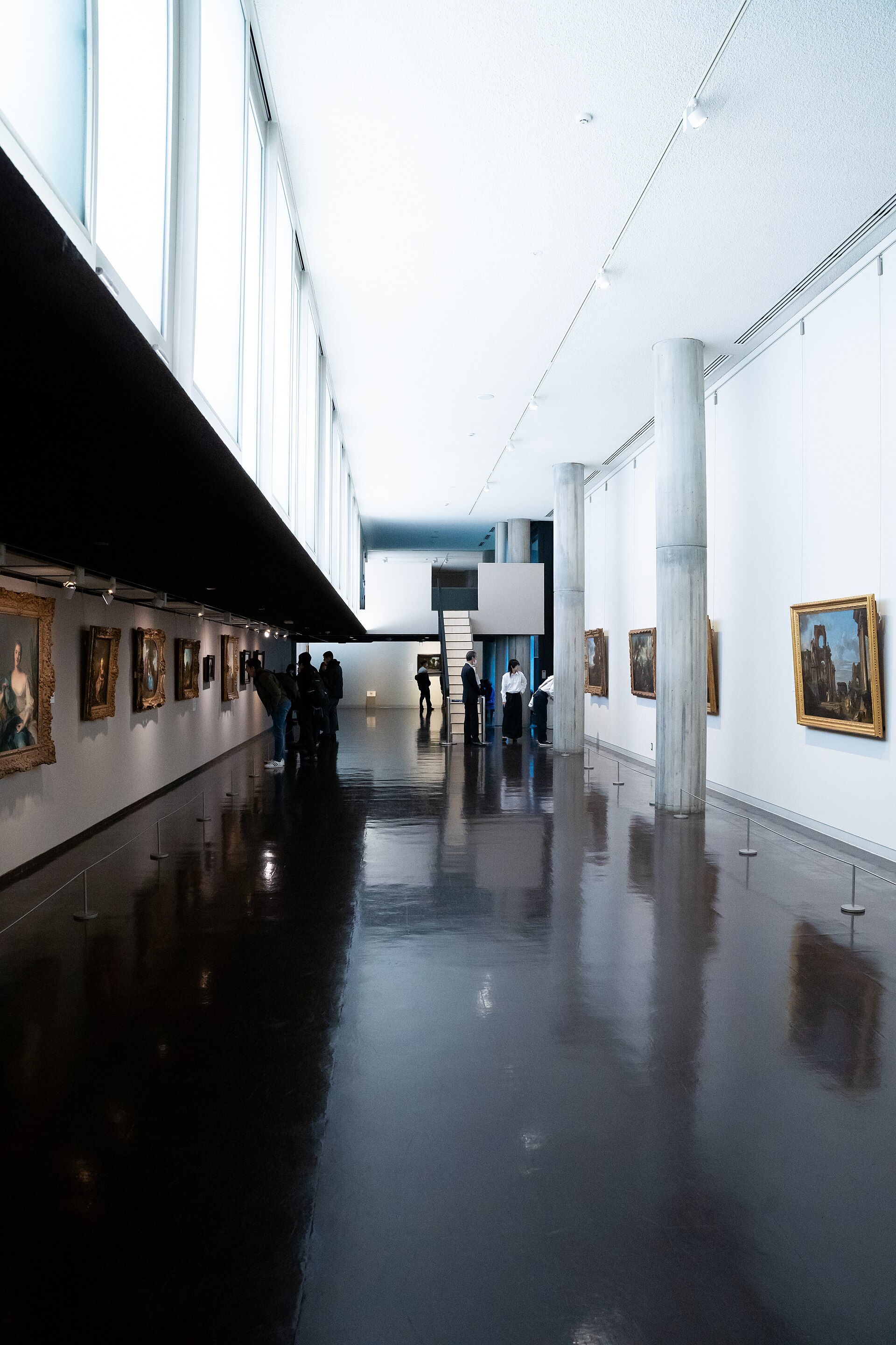 A gallery corridor in the New Wing hung with framed 19th-century paintings