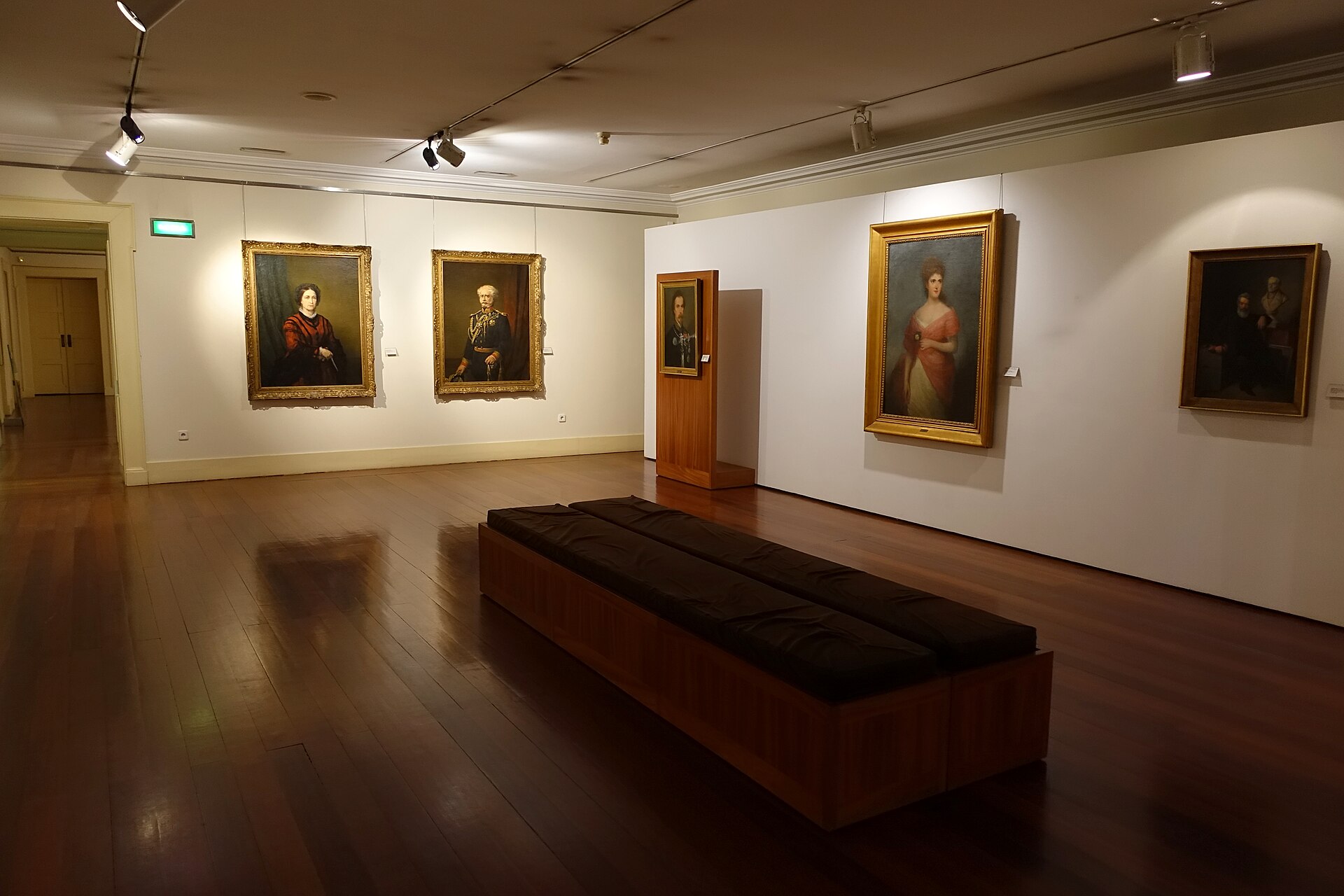 A painting gallery inside the Museu Nacional Soares dos Reis, with framed 19th-century canvases on tall walls