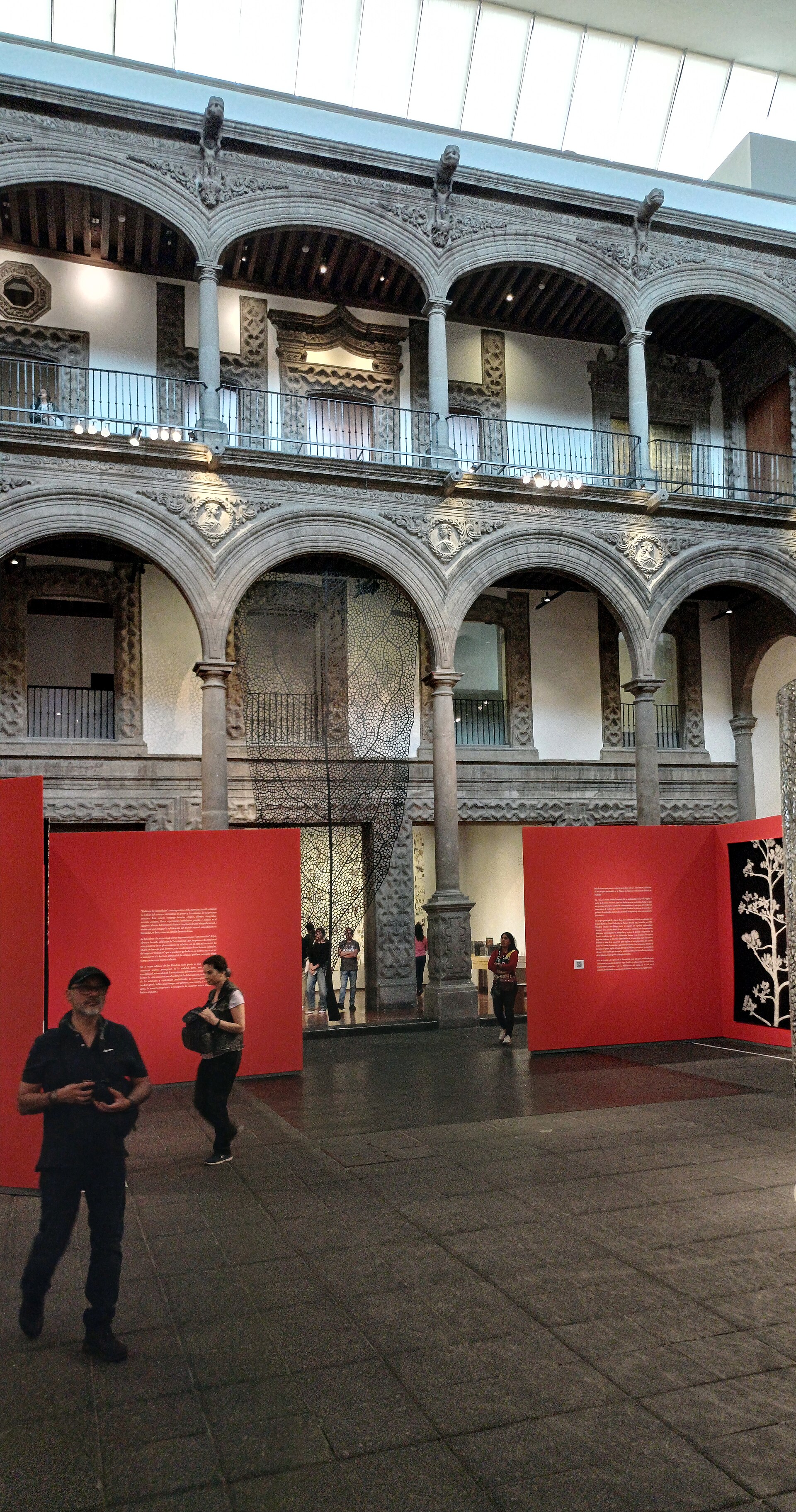 The arcaded stone courtyard of the Palacio de Iturbide, roofed in glass and set up for a temporary exhibition