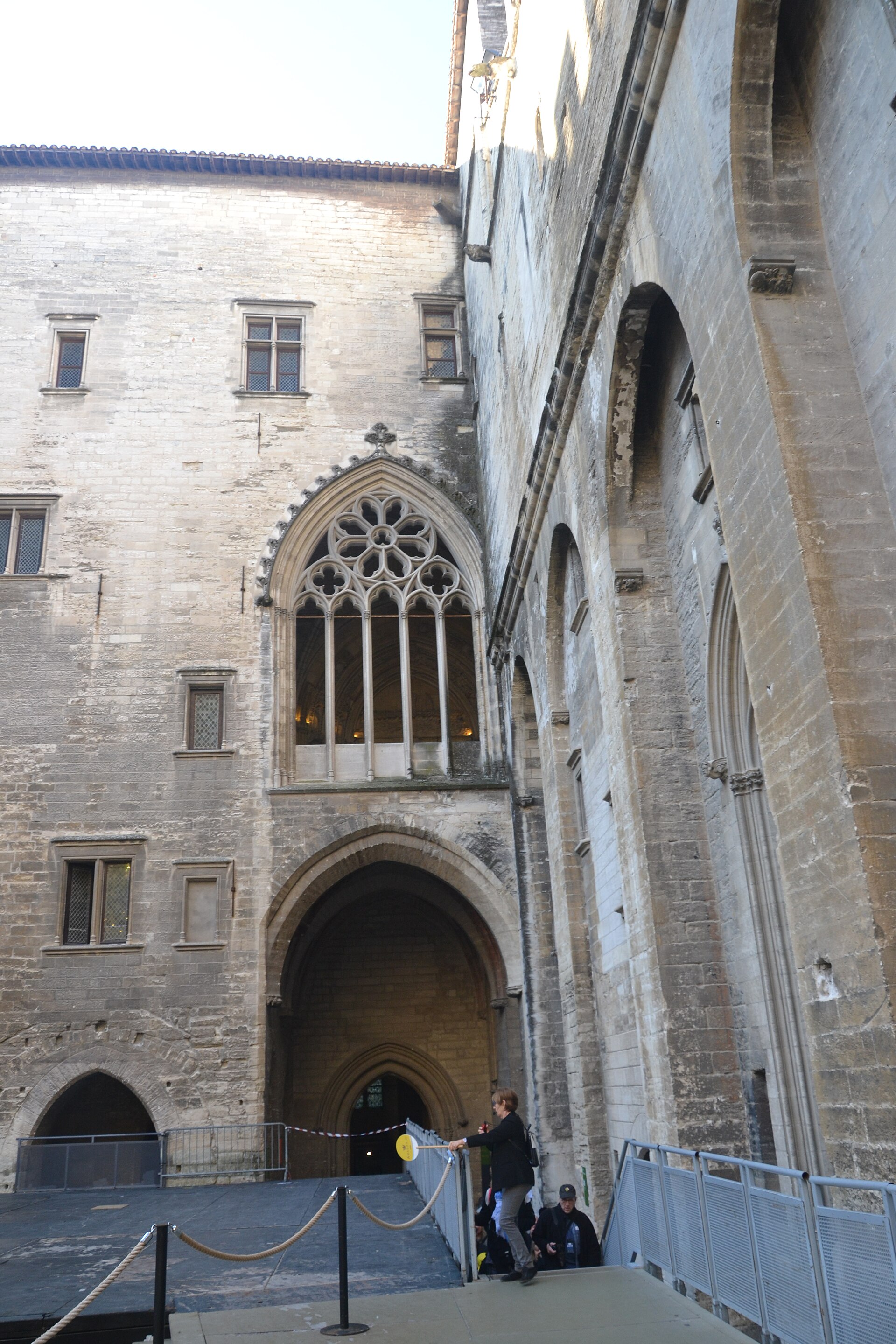 The Cour d'Honneur, the palace's main internal courtyard, seen from ground level looking up at the surrounding towers and entrance porch