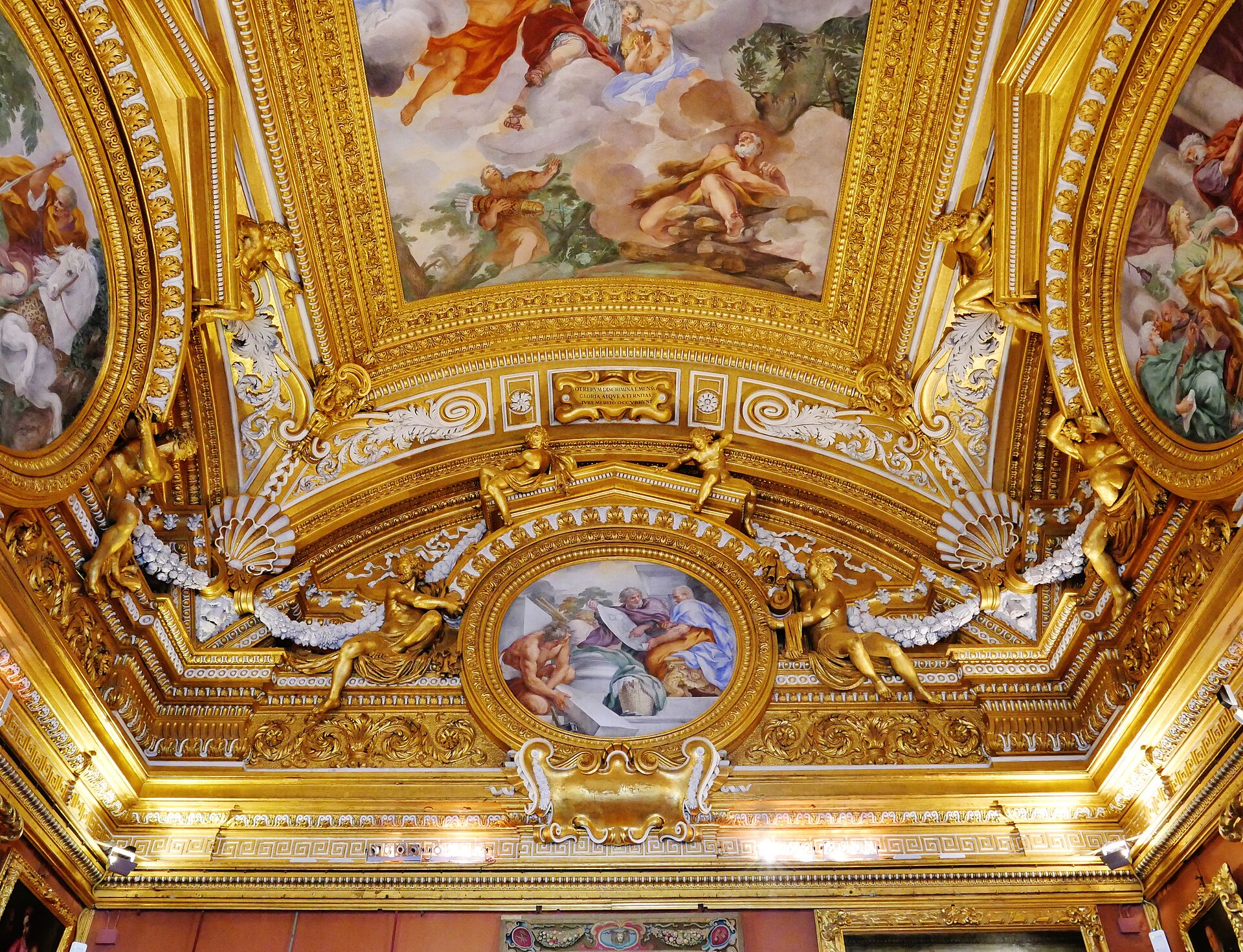 The gilded, frescoed vaulted ceiling of the Sala di Saturno