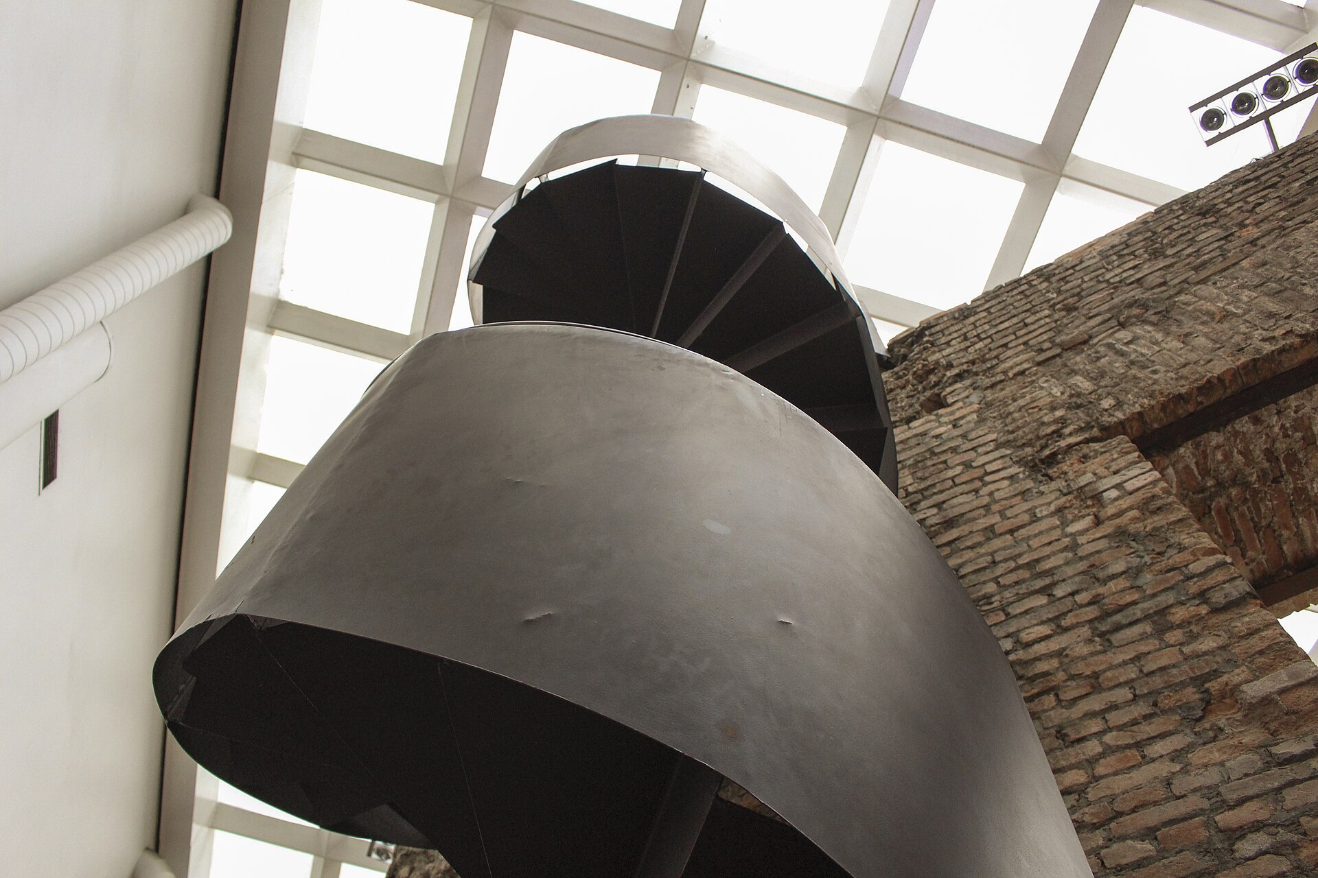 Spiral staircase under the courtyard skylight
