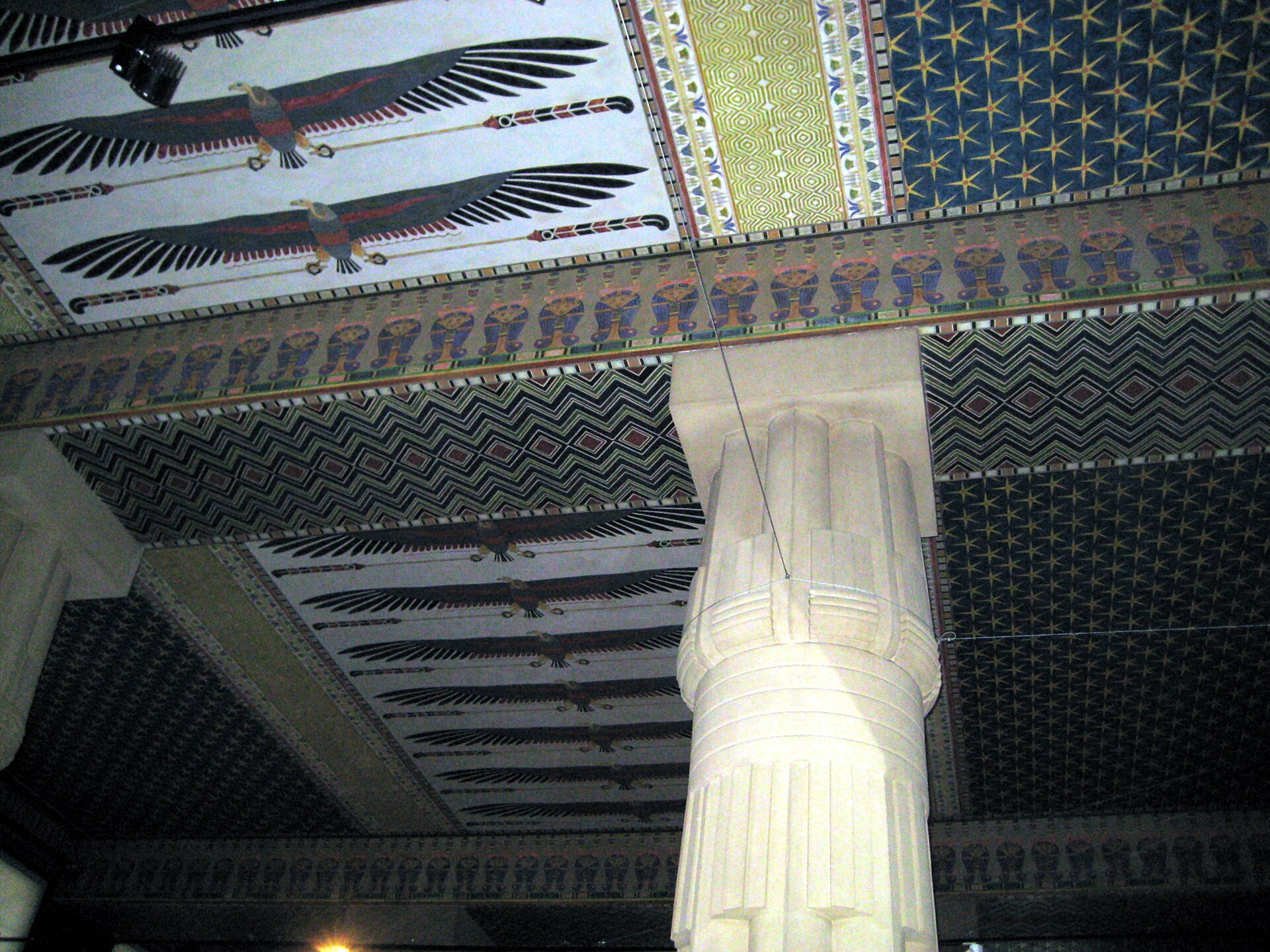 Painted Egyptian-style ceiling frieze and a column in the Art of Ancient Egypt hall