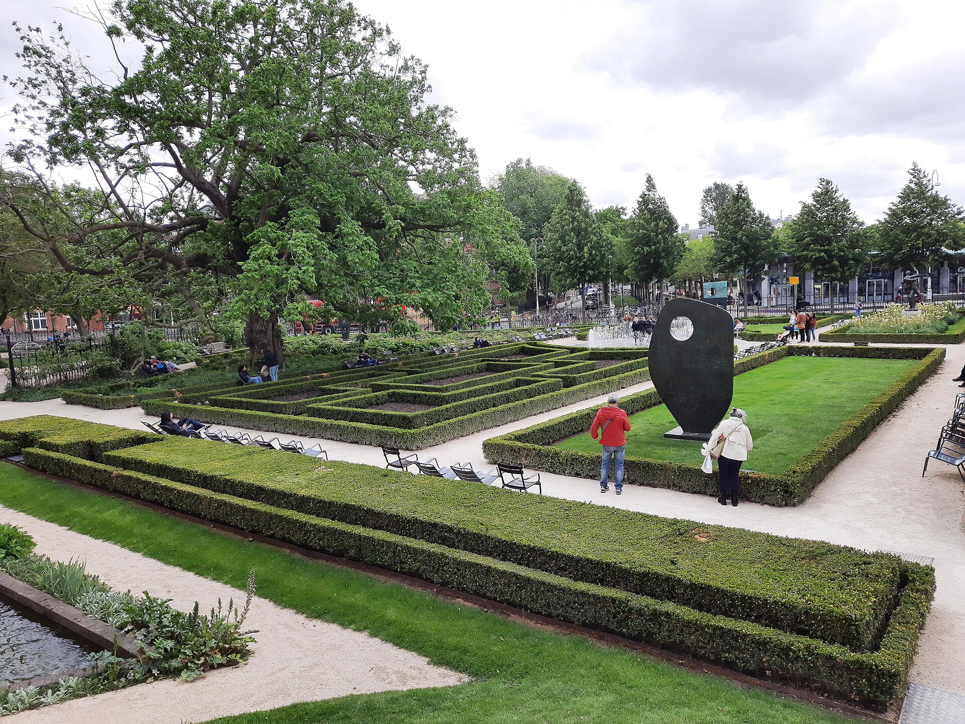 The museum gardens with clipped box parterres, benches and a modern sculpture